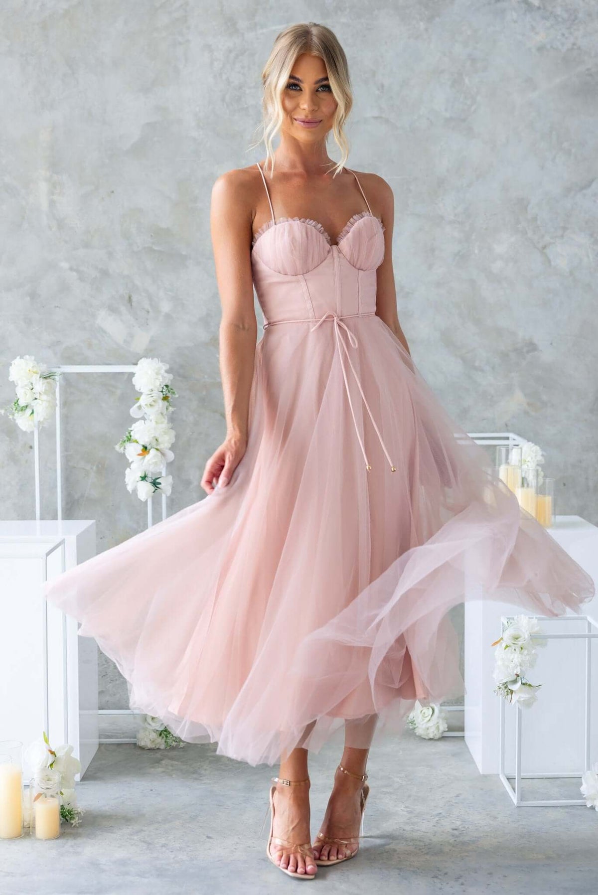 Florence Midi Dress in soft pink with adjustable straps, tulle skirt, and stylish removable tie, perfect for bridal occasions.