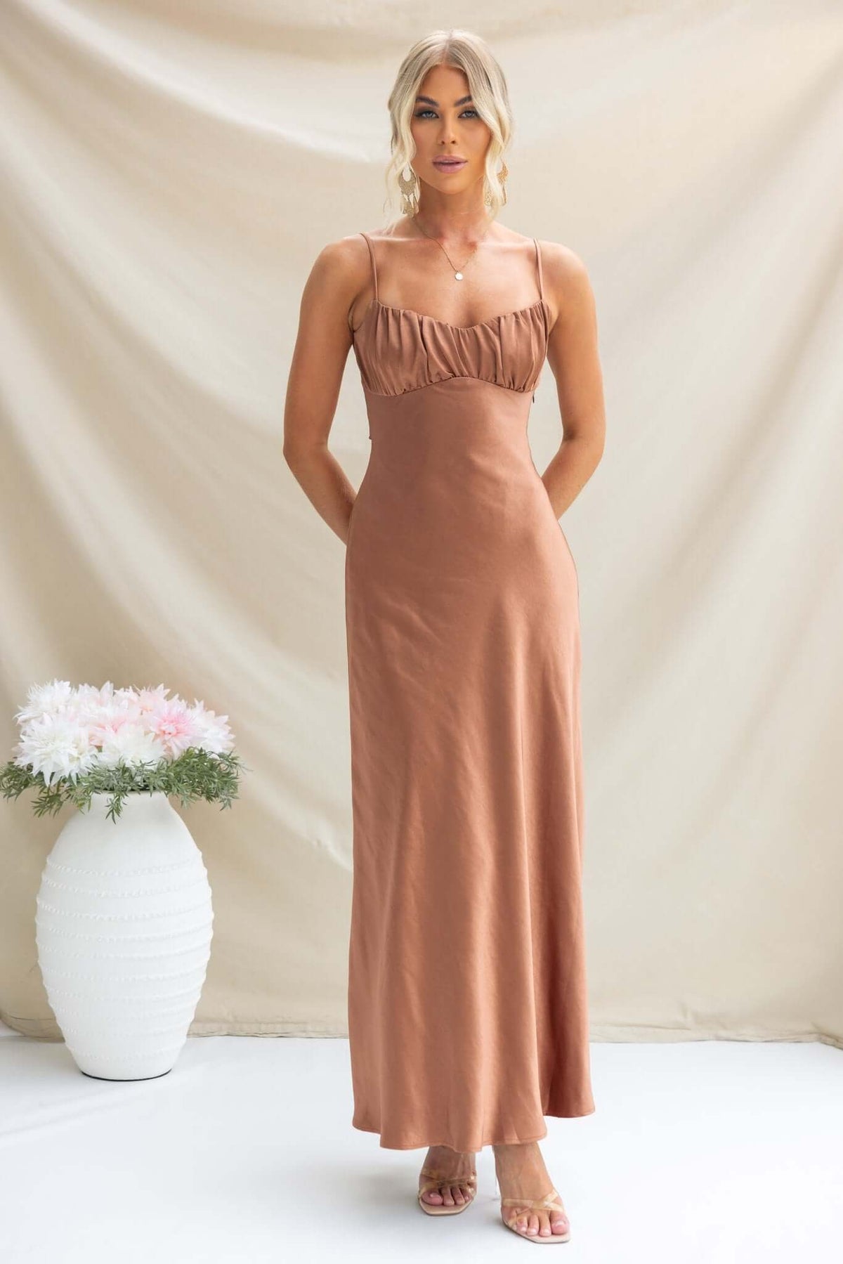 Maeya Maxi Dress in satin with adjustable straps and gathered bust, showcased against a neutral backdrop.