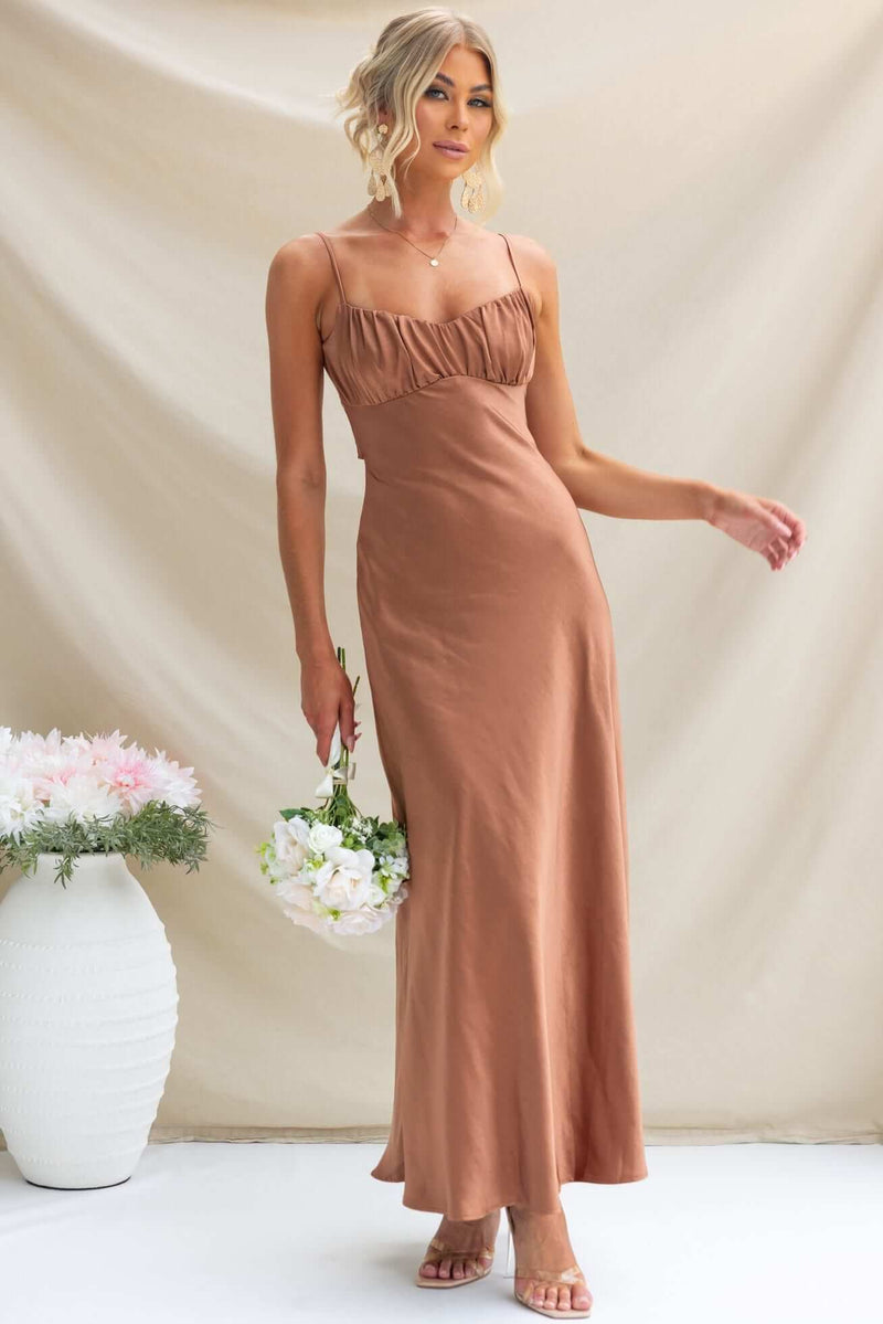 Elegant Maeya Maxi Dress in brown with adjustable straps, gathered bust, and a flattering silhouette.
