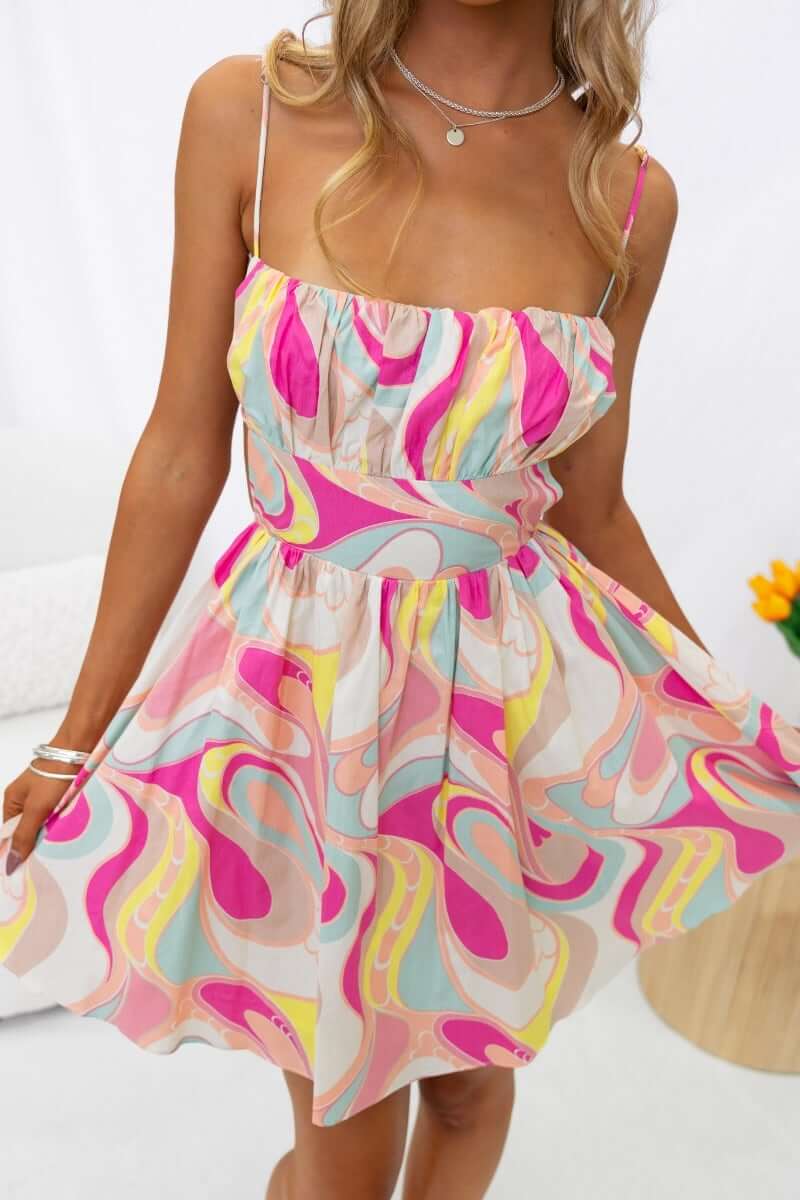Colorful Tarnee Dress with adjustable straps and tie detail, perfect for summer styling.