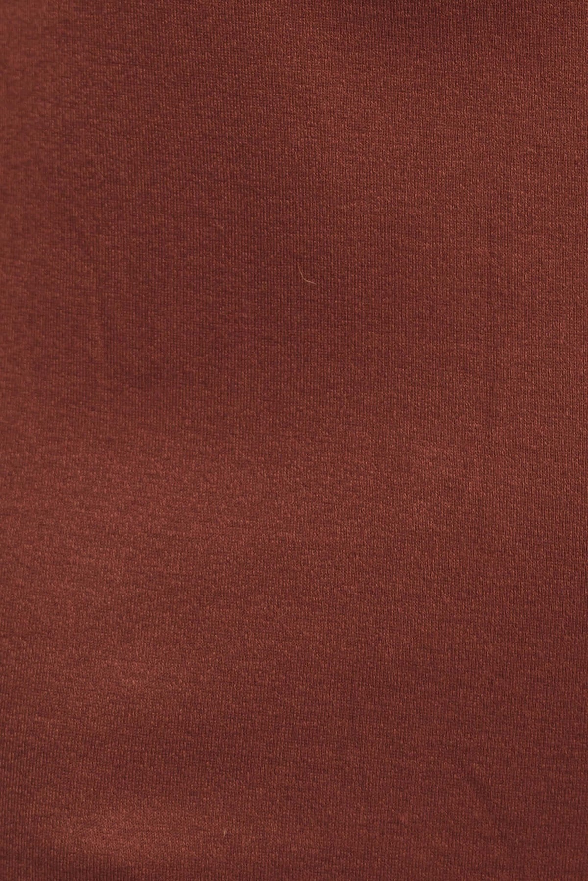 Close-up of rich brown fabric used in the Kartier Midi Dress, featuring a smooth, stretchy texture.