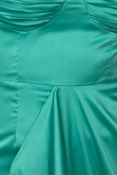 Detail of Qandice midi dress in satin fabric with pleated bust and soft draping hem.