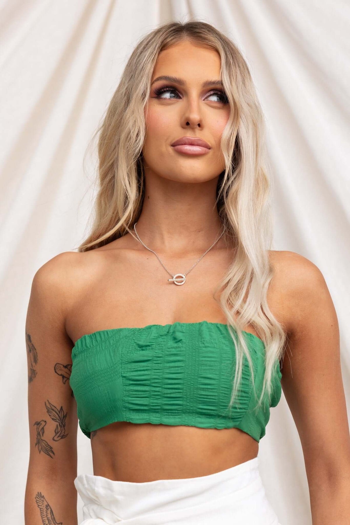 Omalie Top in green, textured strapless style with anti-slip bust and elastic back, perfect for summer outfits.