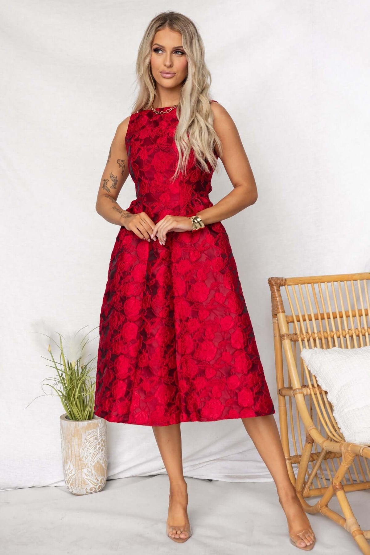 Model wearing a Jadyne Midi Dress in red floral texture, showcasing a classic design with a flattering fit.