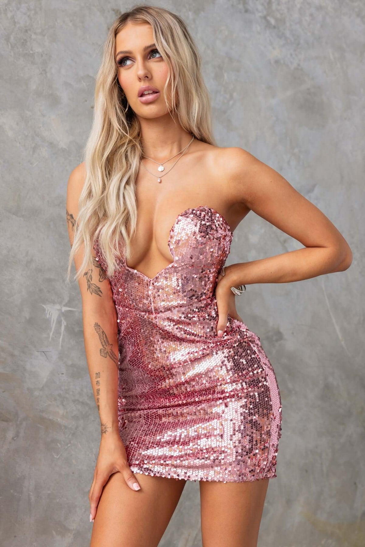 Qordelia Dress: Strapless sequin dress with padded bust, anti-slip, and invisible zip in pink, perfect for special occasions.
