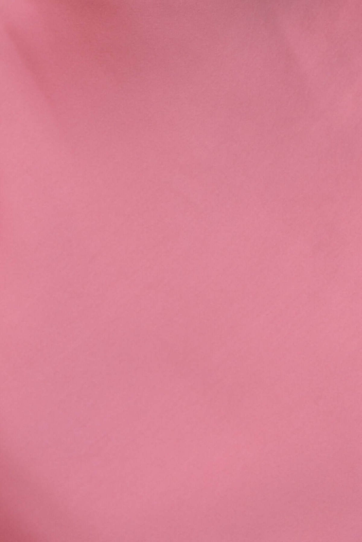 Close-up of soft pink fabric, showcasing a satin look and smooth texture ideal for elegant dress designs.