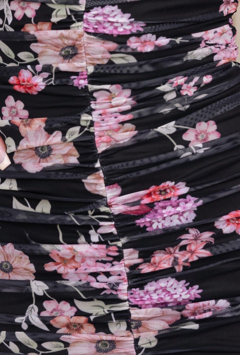 Close-up of ruched black mesh material with floral print for Zachia Maxi Dress, showcasing details of the design.