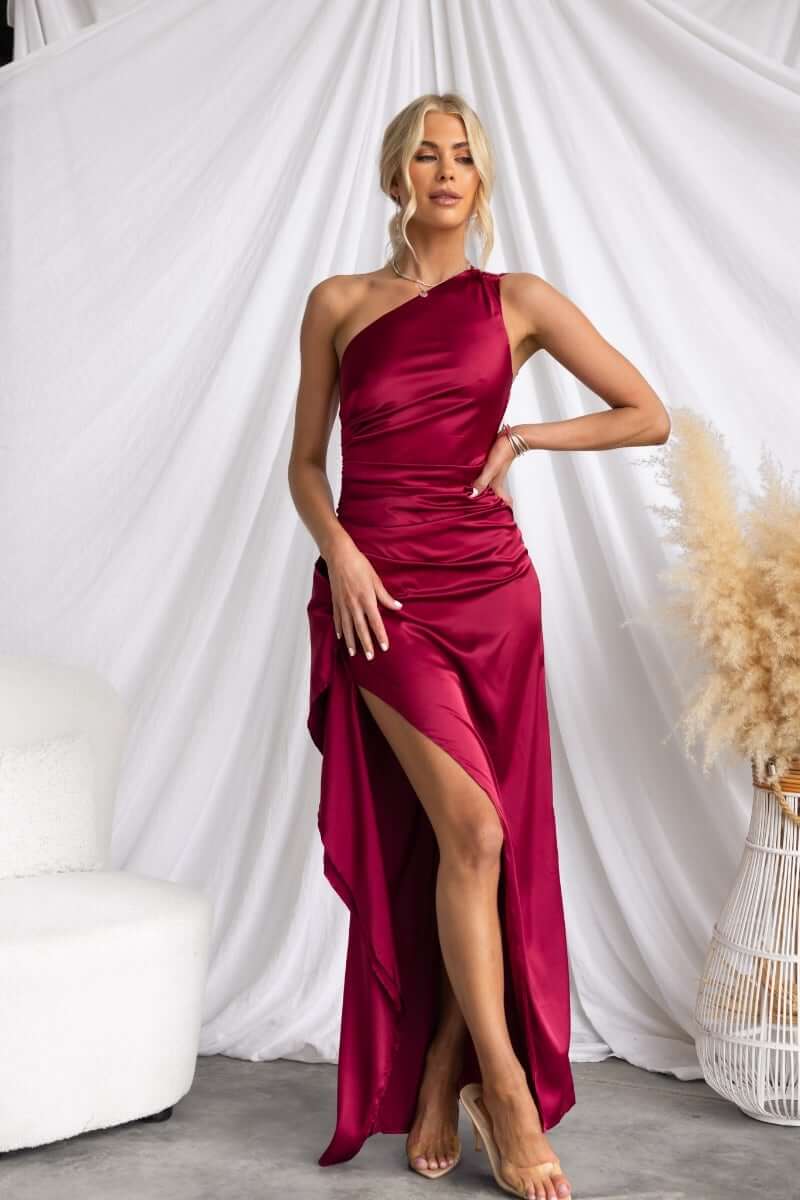 Stylish red satin Dimmi Maxi Dress with one-shoulder neckline and asymmetrical hemline.