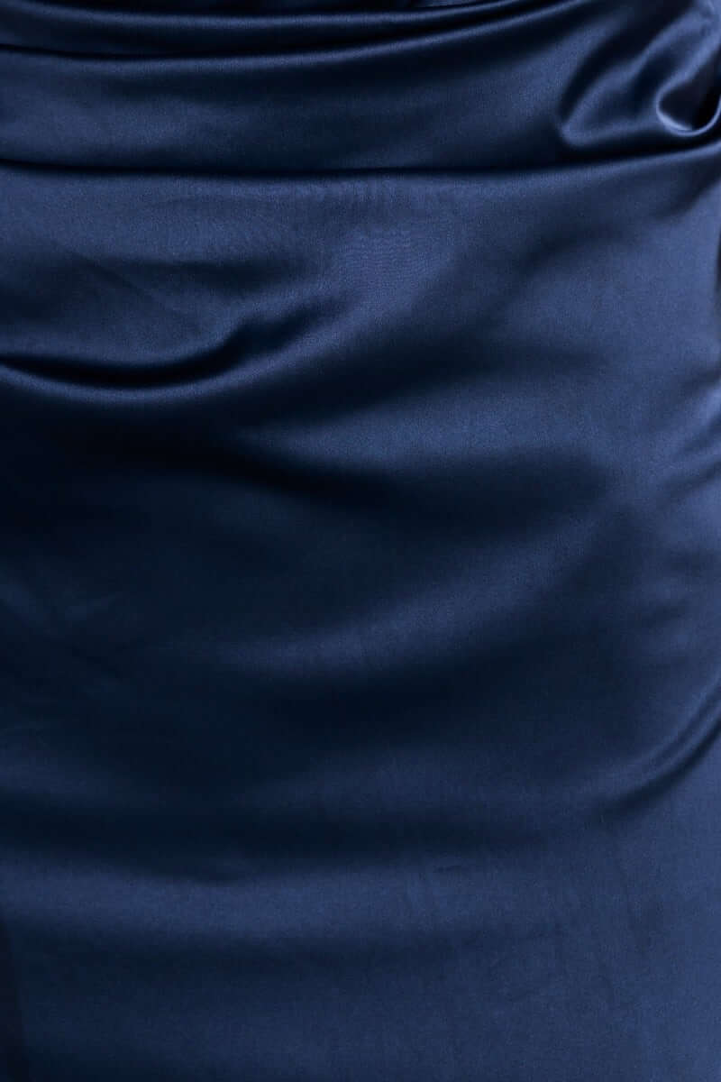 Close-up of navy satin fabric texture of the Dimmi Maxi Dress showcasing its sleek silhouette.