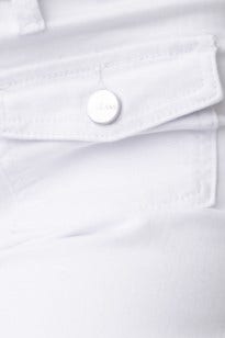 Close-up of white denim jeans featuring a button and front pocket detail for stylish casual wear.