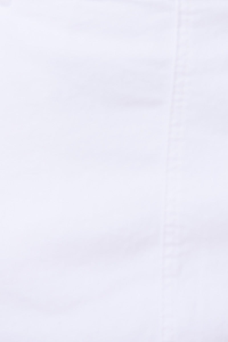 Close-up view of white fabric showing texture and stitching, ideal for casual wear like dresses or tops.