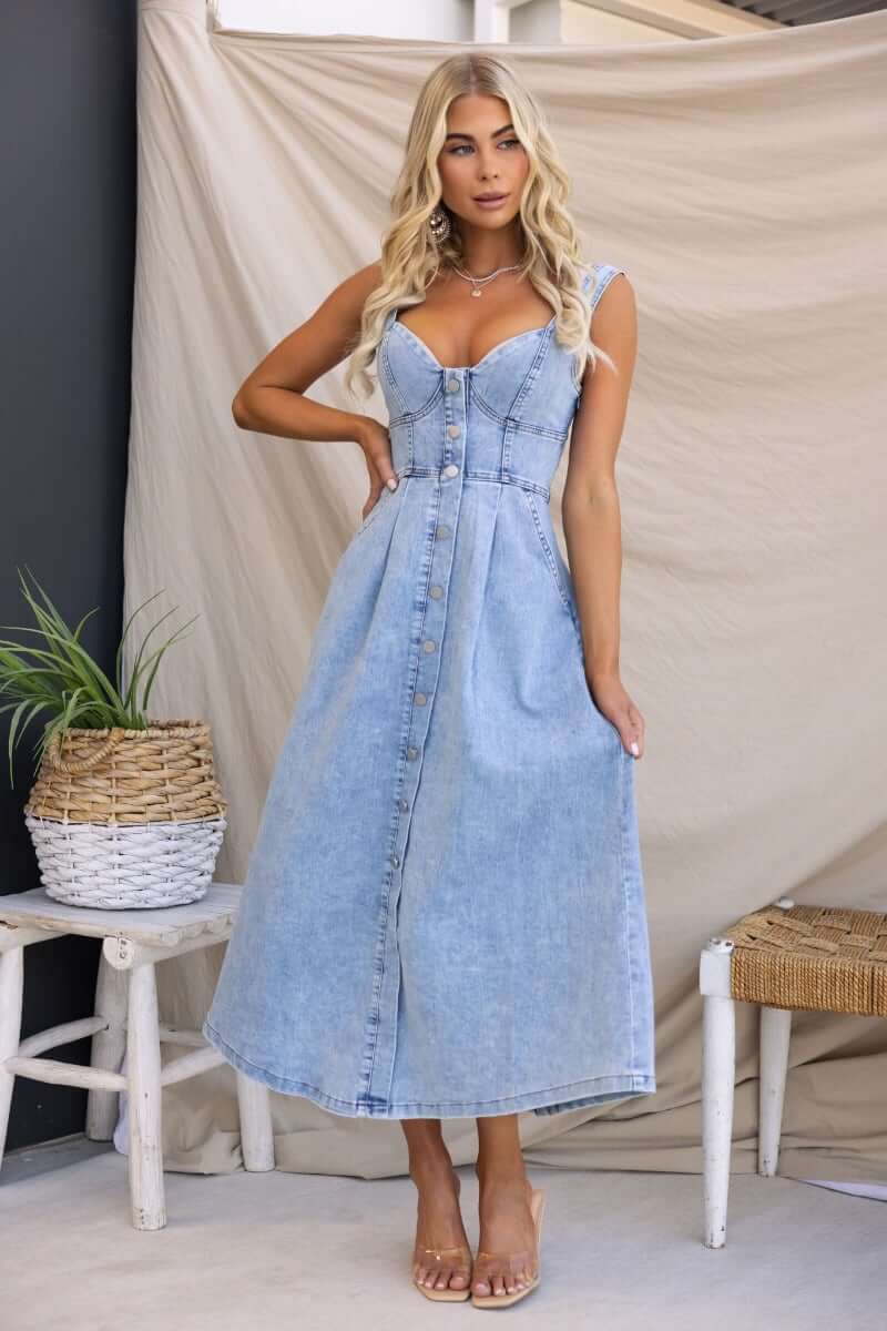 Tailey Denim Midi Dress with faux button-up front and elastic back, featuring pockets and side zip in light blue denim.