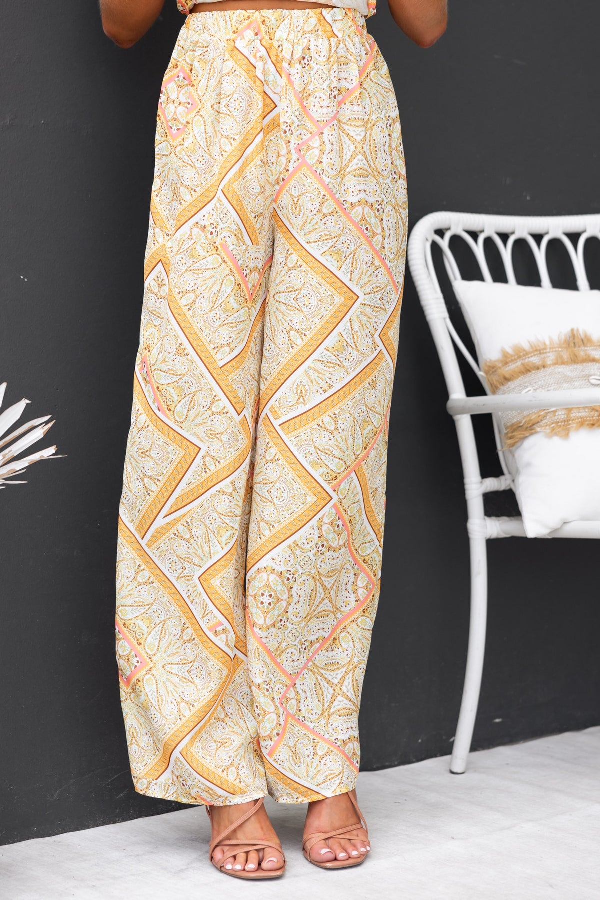 Vivid pants featuring abstract print, elastic waistband, and light material for a comfortable fit.