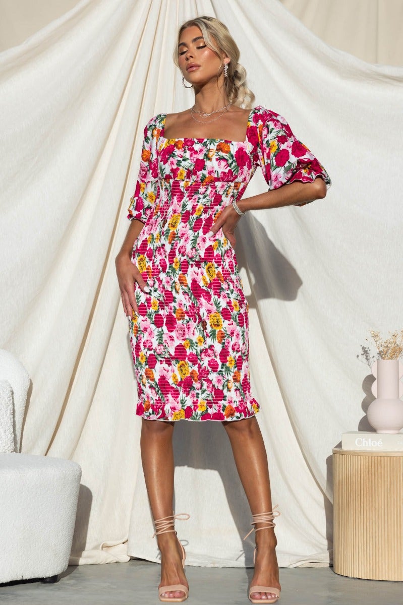 Floral Arabella Midi Dress with elastic fittings, featuring vibrant colors by Amaroso The Label, model is wearing size 6/XS.