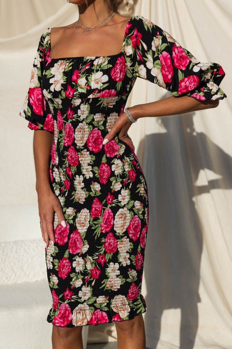 Floral Arabella Midi Dress with elastic sleeves and neckline, model wearing size 6/XS, featuring a standard fit.