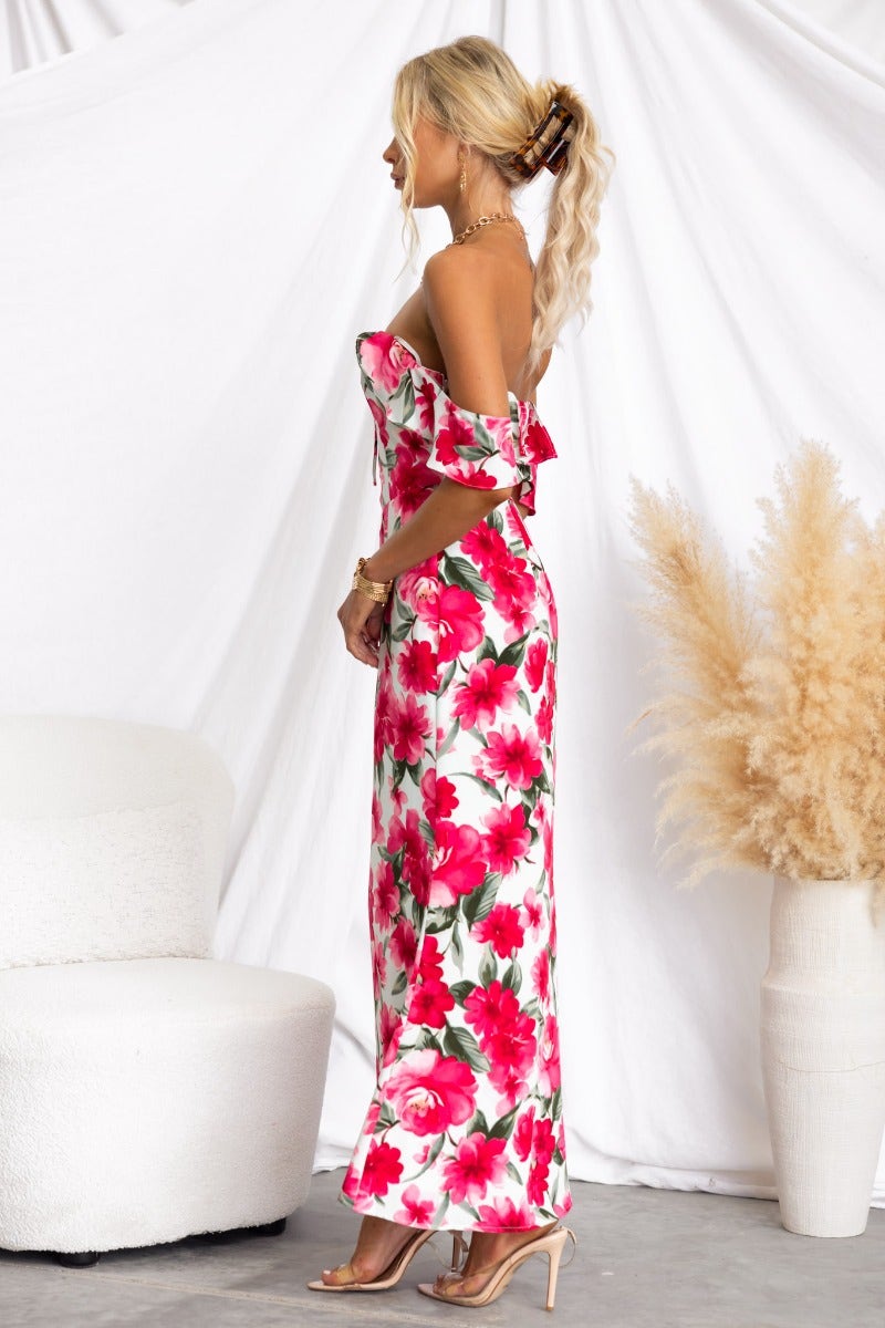 Side view of a floral print off-shoulder maxi dress featuring tie detail and invisible zip, perfect for summer occasions.