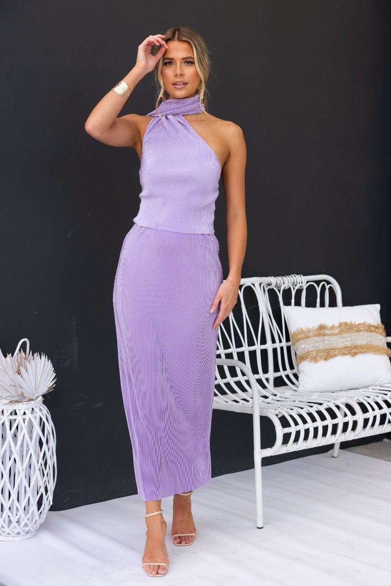 Amethyst maxi skirt with accordion pleats and elastic waistband, styled elegantly with a matching top.