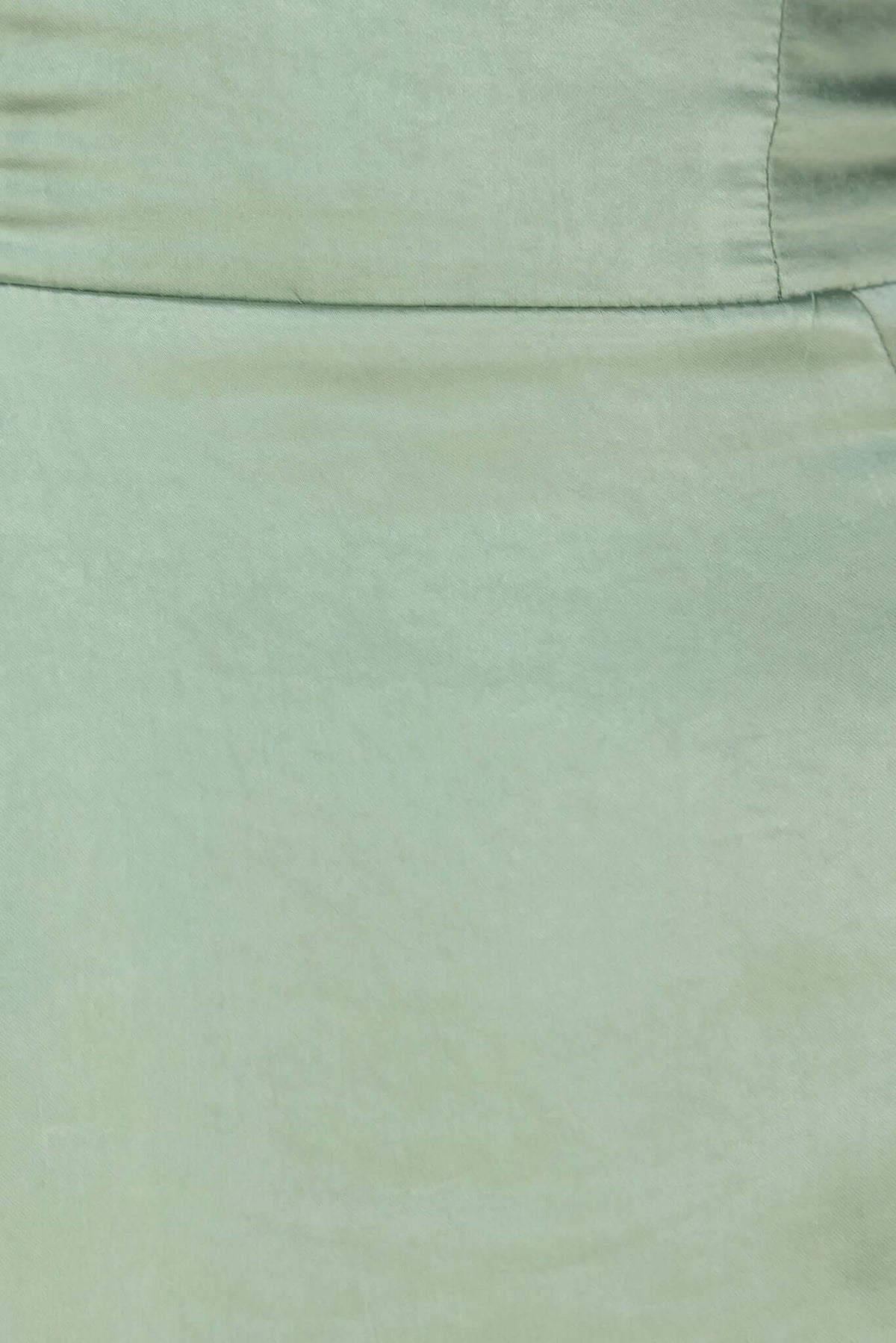 Close-up view of Sonnet Maxi Dress in soft green satin material, highlighting the smooth texture and elegant design.