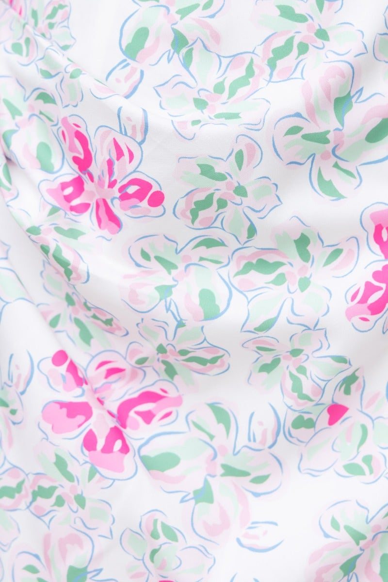 Floral print fabric close-up featuring pink and green flowers on a white background, perfect for the Jenni Midi Dress.