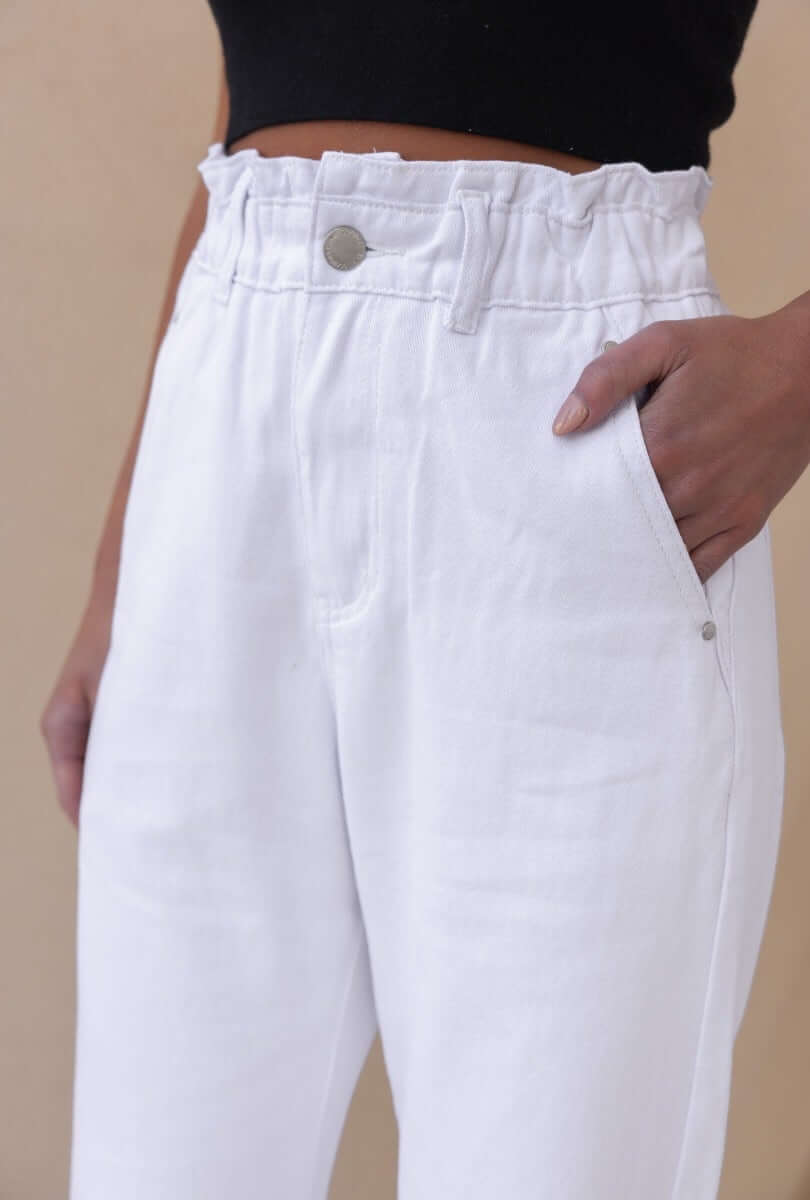 Cameron Paperbag Jeans featuring an elastic waistband and pockets, shown in close-up with a white denim finish.