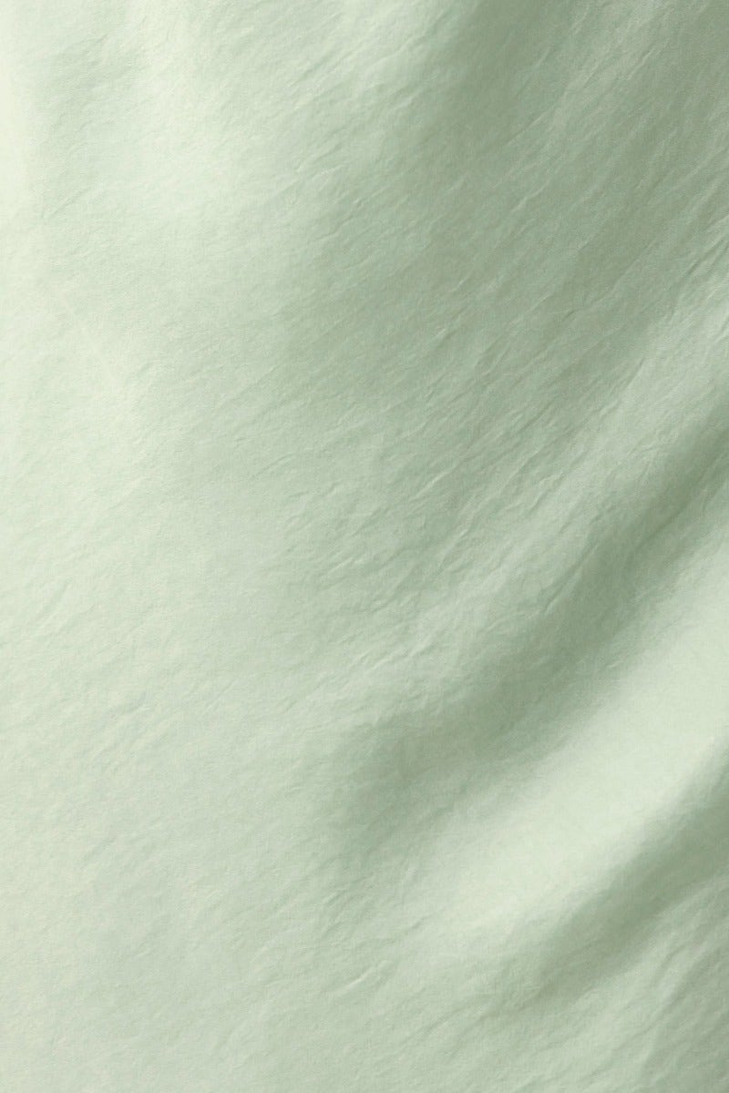 Lightly textured mint green fabric close-up, ideal for creating a stylish Laken Maxi Dress.