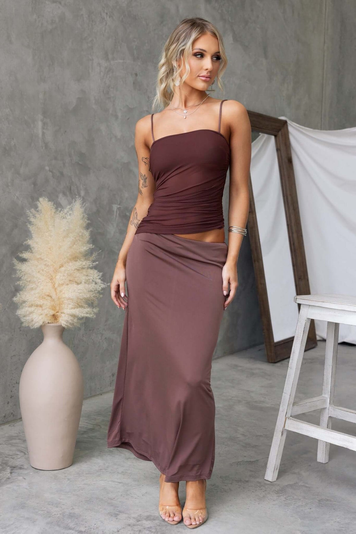 Denham Maxi Dress featuring adjustable straps, square neckline, and cut-out waist in stylish brown color.