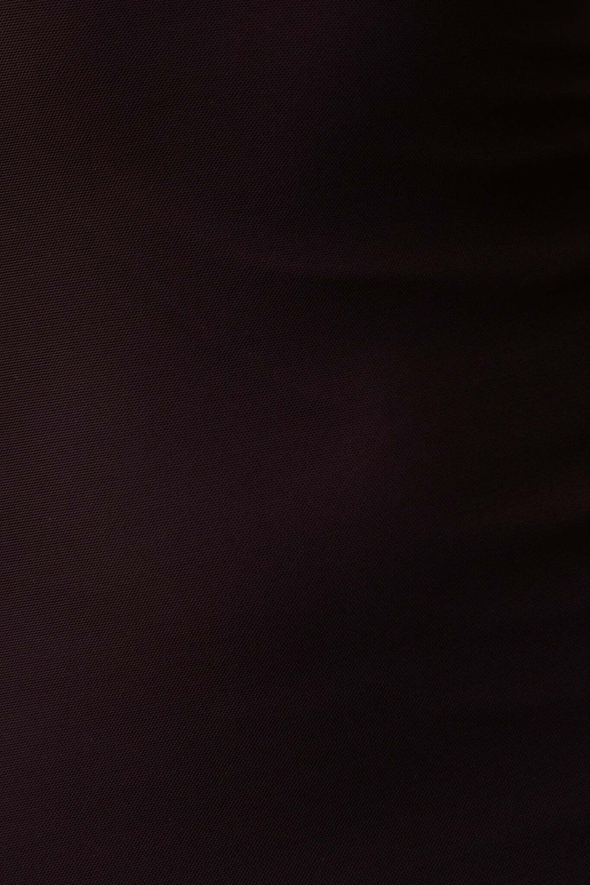 Close-up of the smooth, dark fabric of the Enigma Maxi Dress showcasing its texture and quality.