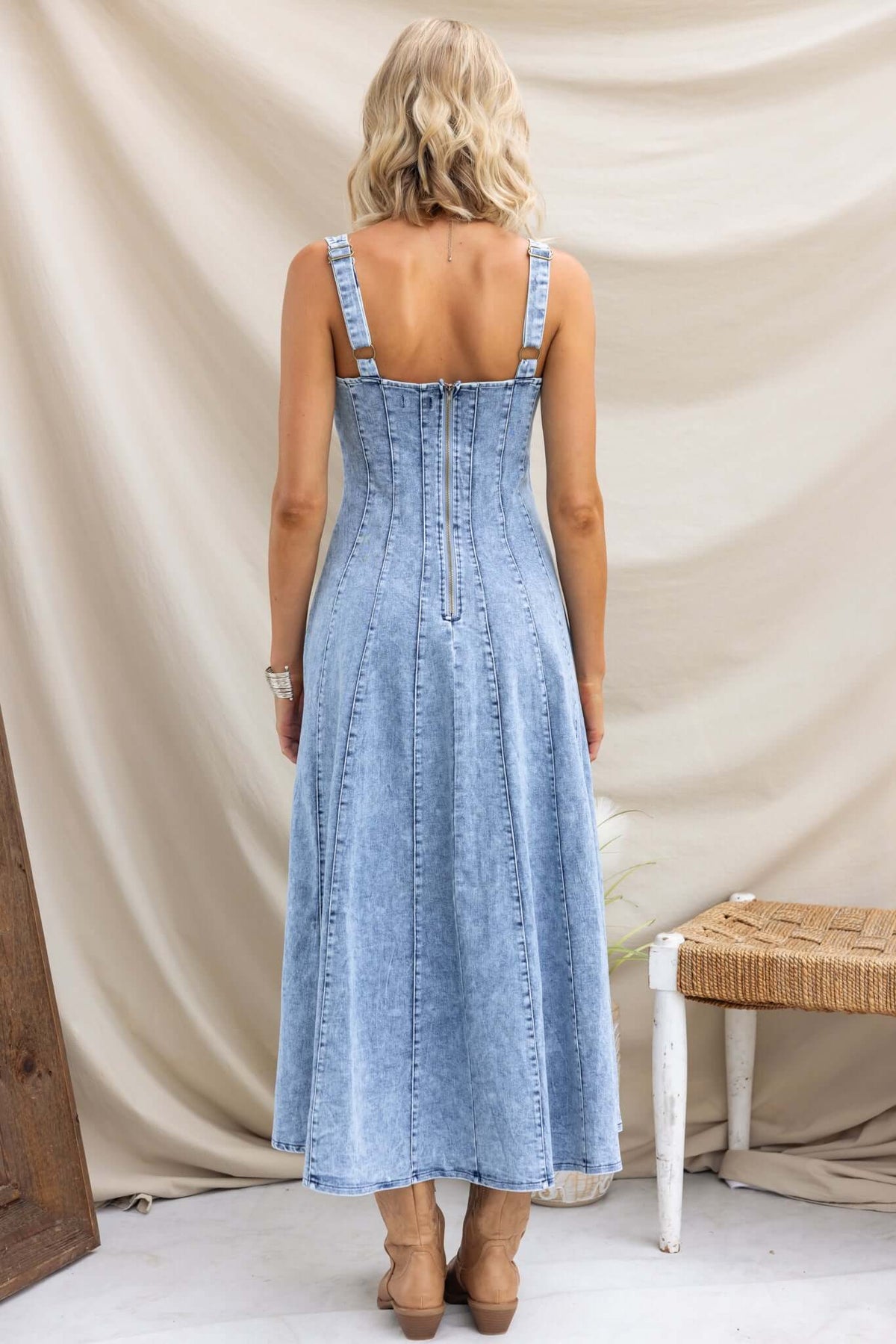Back view of Annette Maxi Denim Dress featuring adjustable straps and zip closure.