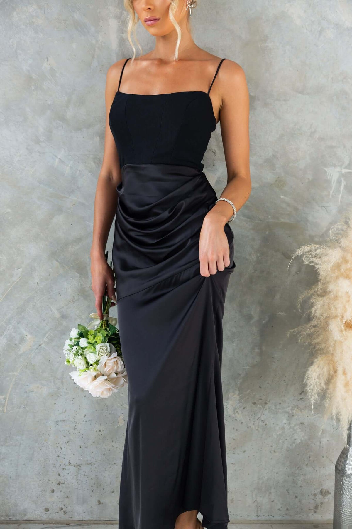 Model wearing Atheni Maxi Dress by Amaroso Bridal, featuring adjustable straps and elegant satin skirt.