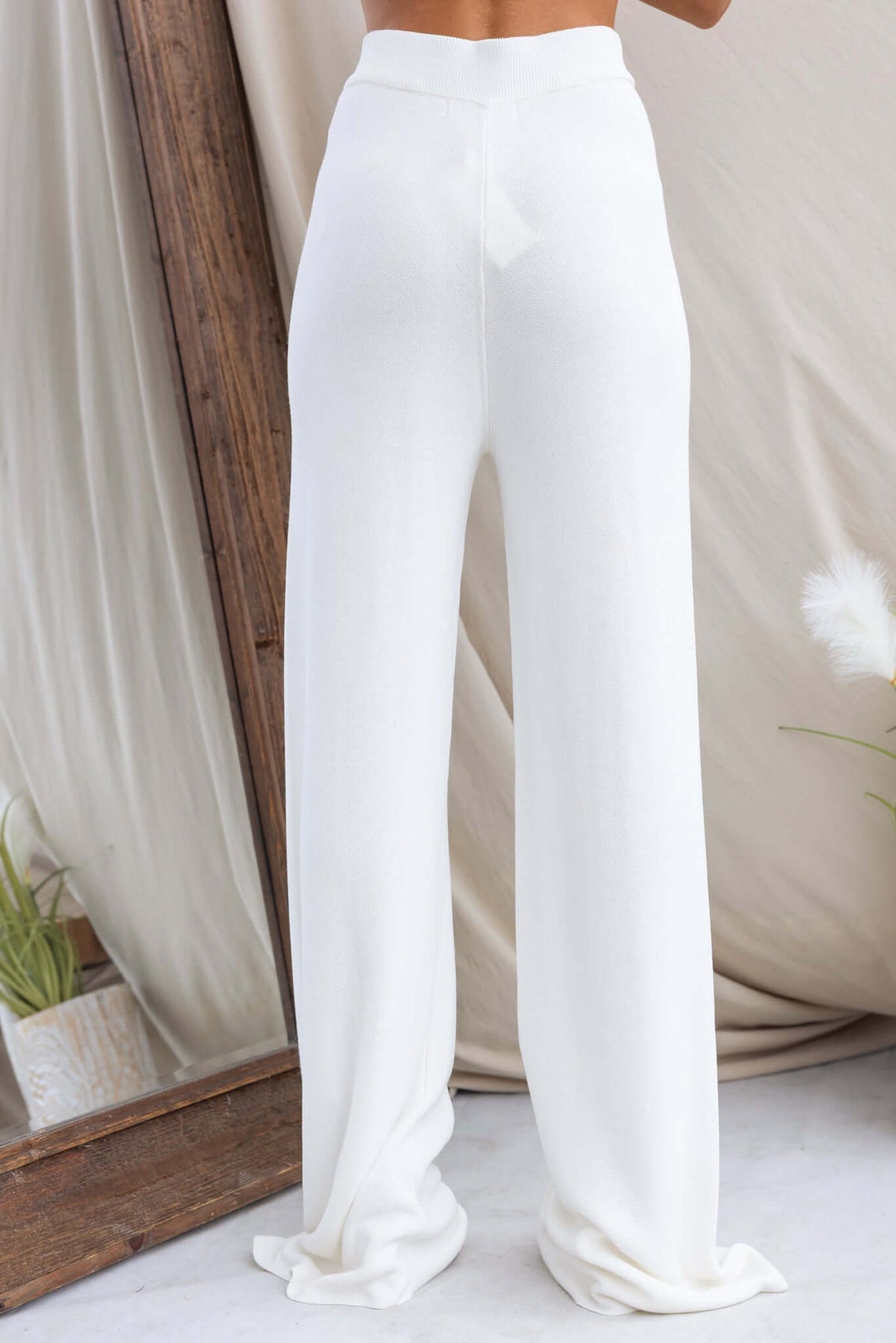 Beacall Pants in white, featuring mid-high waist, elastic waistband, and soft knit material for a flattering fit.