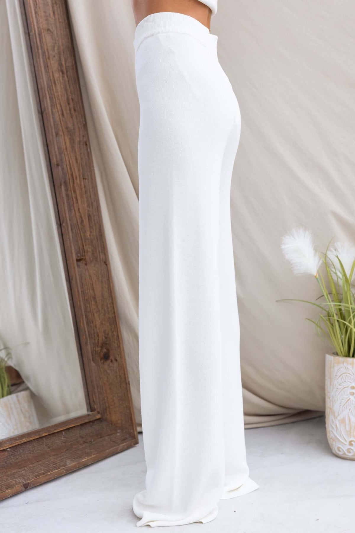 Beacall Pants in white with mid-high waist, elastic waistband, and stretch knit material, displayed from the side.