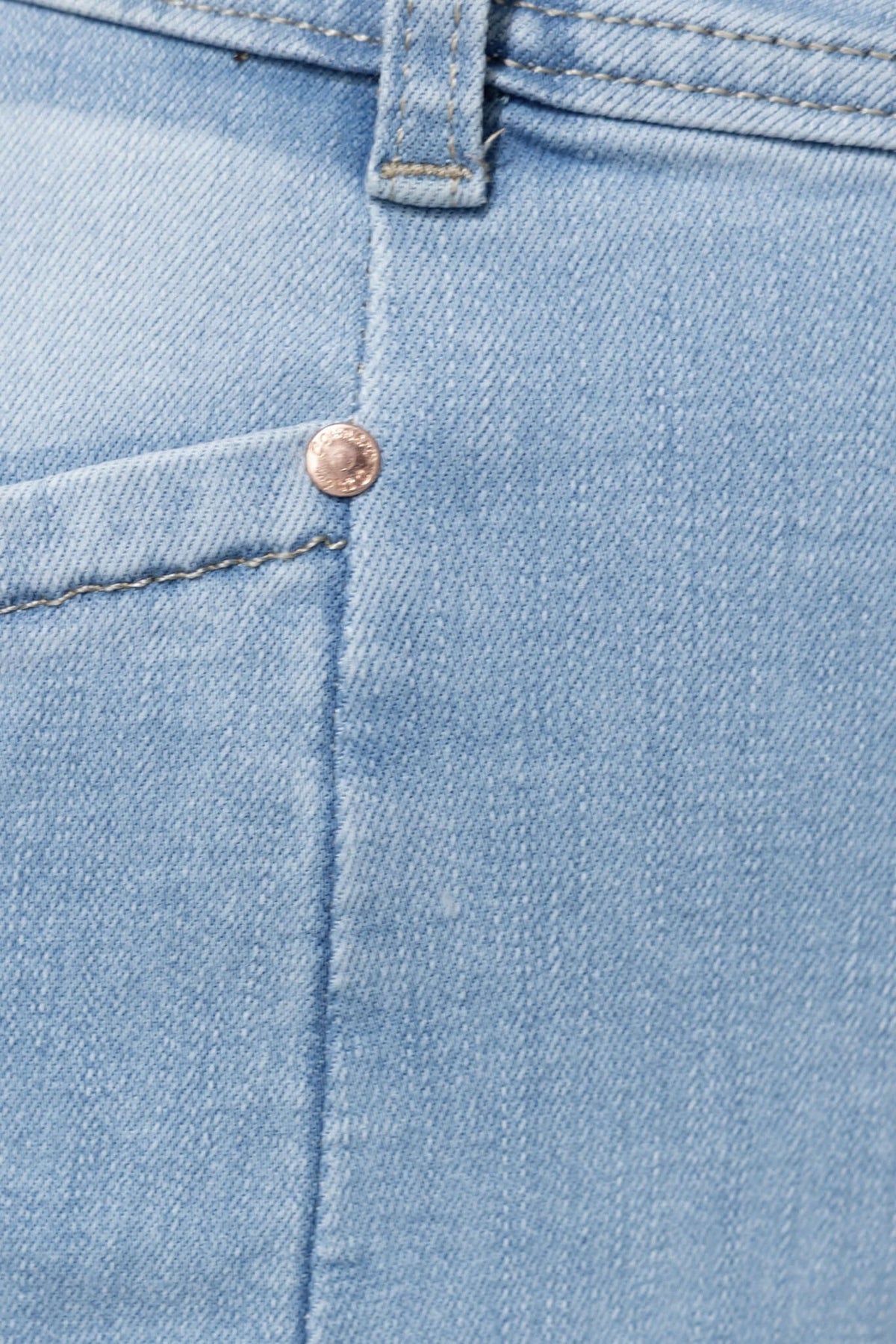 Close-up of stylish Blanca Jeans showing mid-high waist fit and pocket detail in light blue denim.