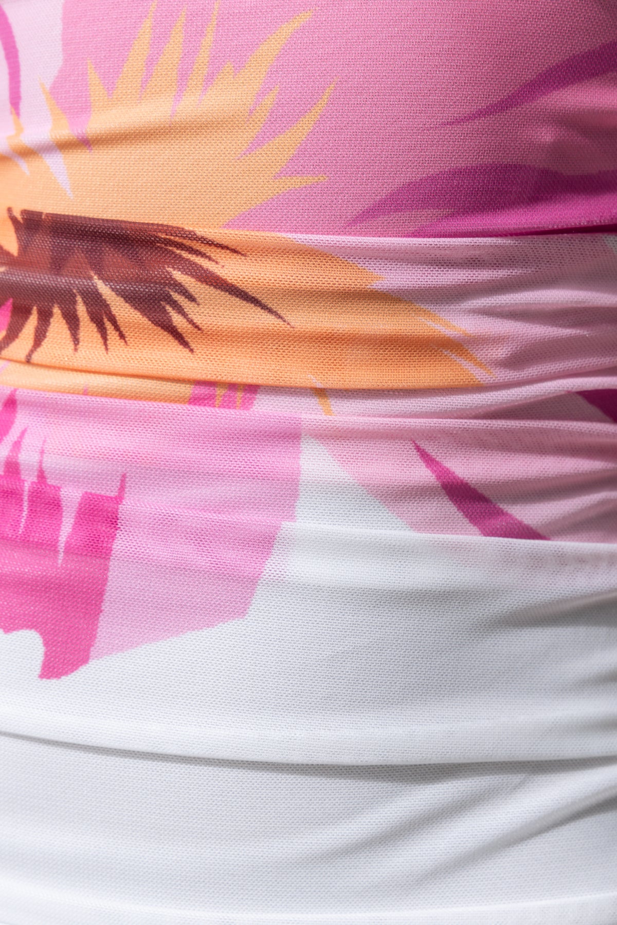 Close-up of floral print on Blax Maxi Dress showcasing colorful mesh material and ruching detail.
