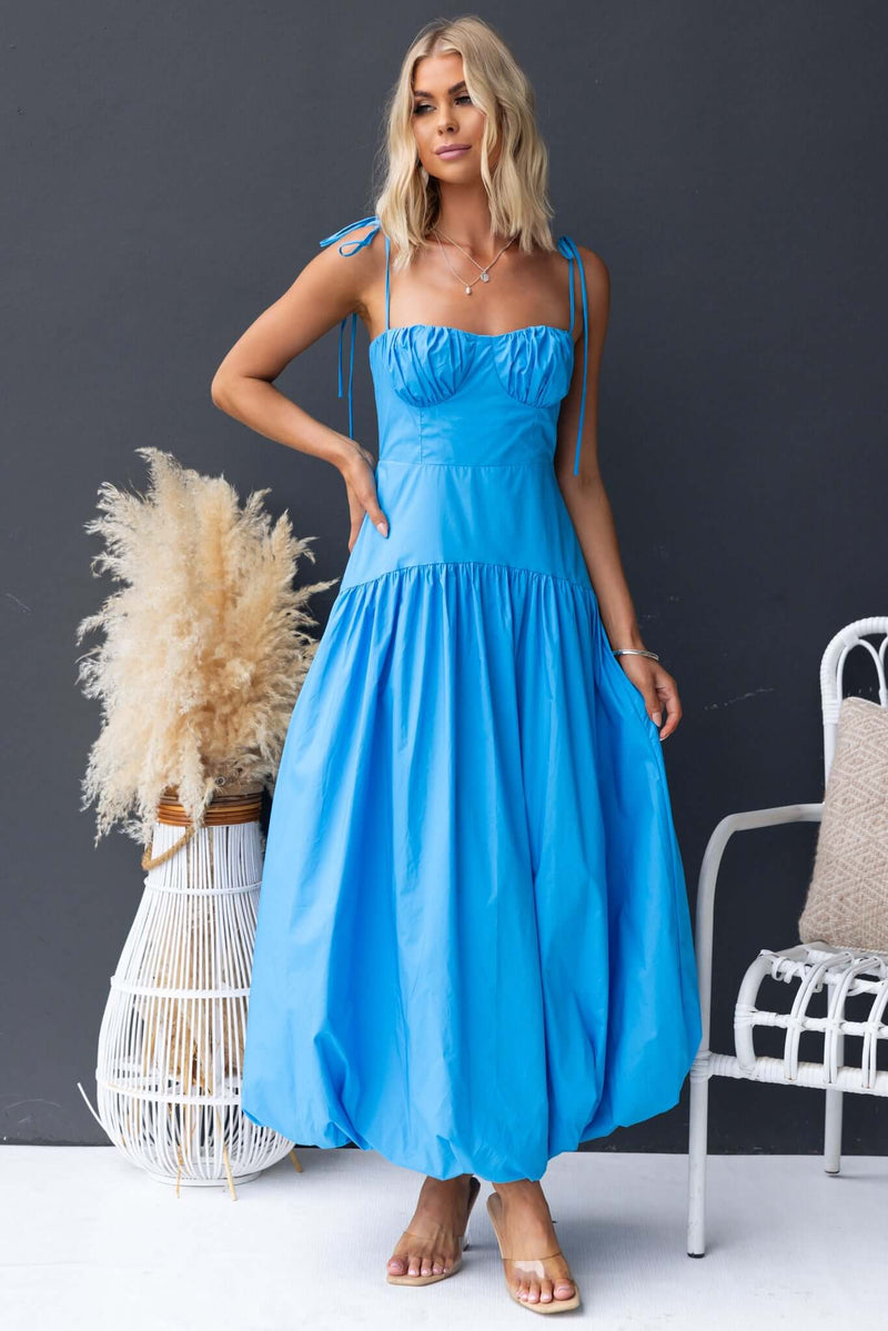 Elegant Bonisa Maxi Dress in bright blue with tie straps and flowing silhouette, perfect for summer occasions.