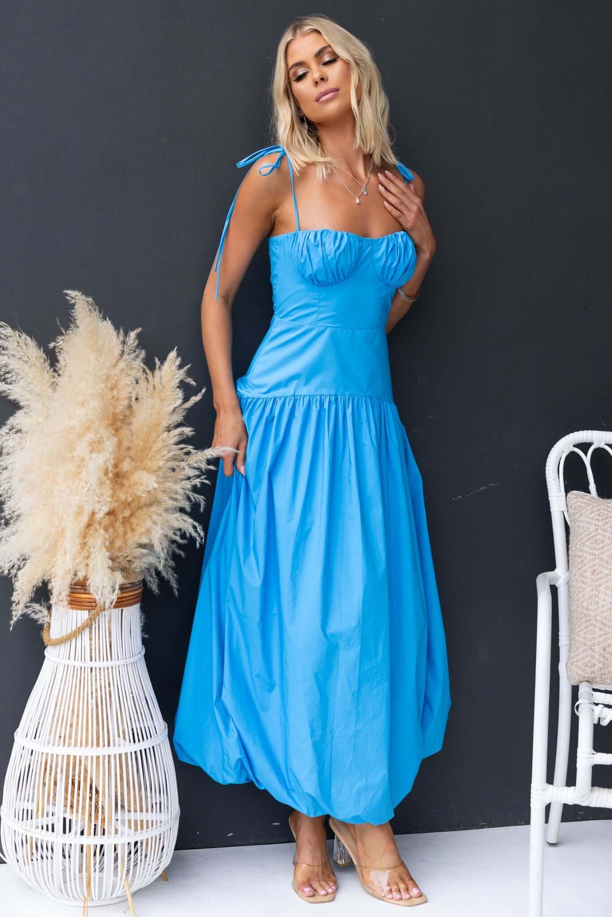 Model wearing a light blue Bonisa Maxi Dress featuring tie straps and a flowing silhouette.