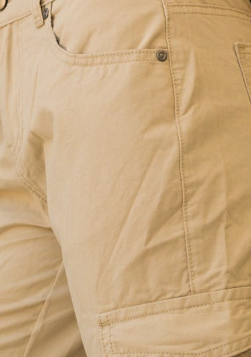 Close-up of Bowie Cargo Pants in light tan color, showcasing pockets and fabric texture.