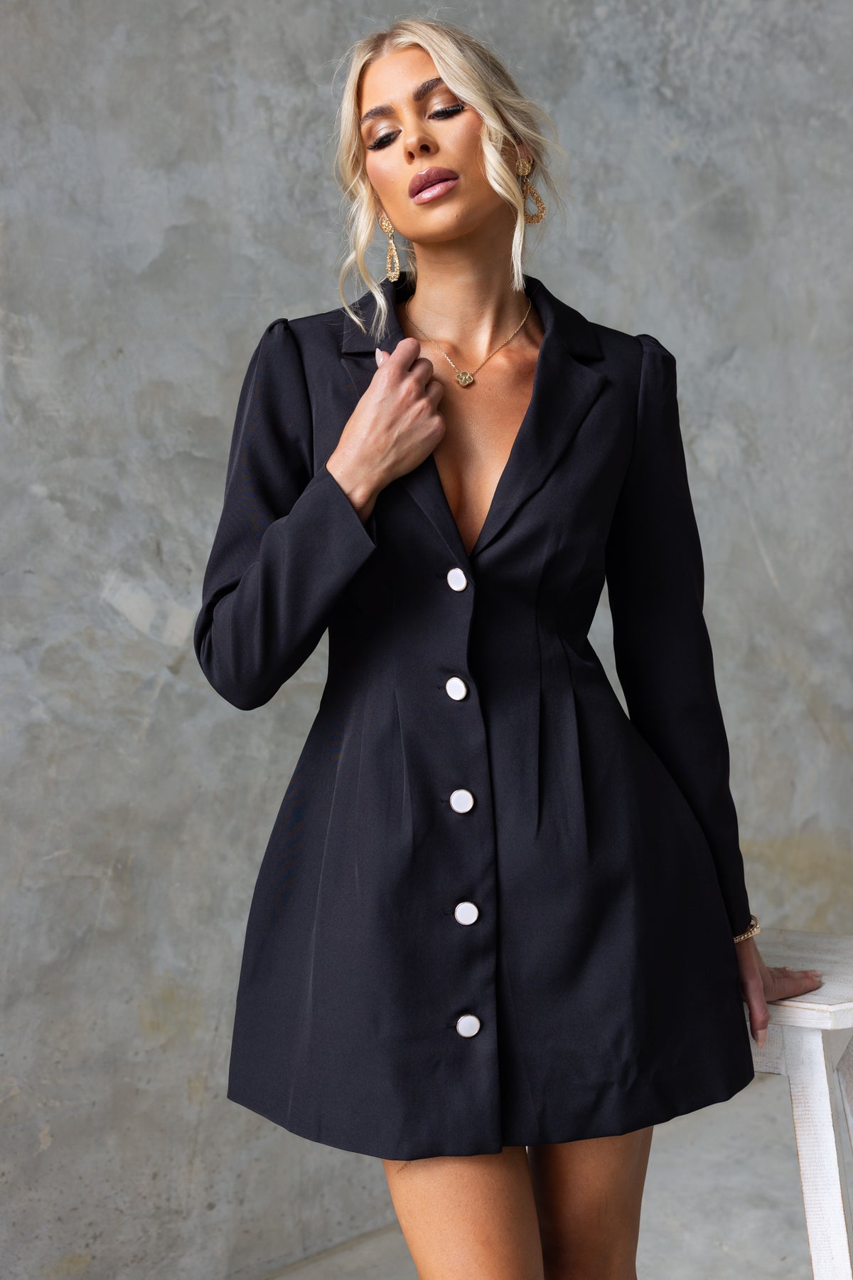 Brookings Dress featuring V-neckline, shoulder pads, and button-up front, tailored fit, perfect for stylish occasions.