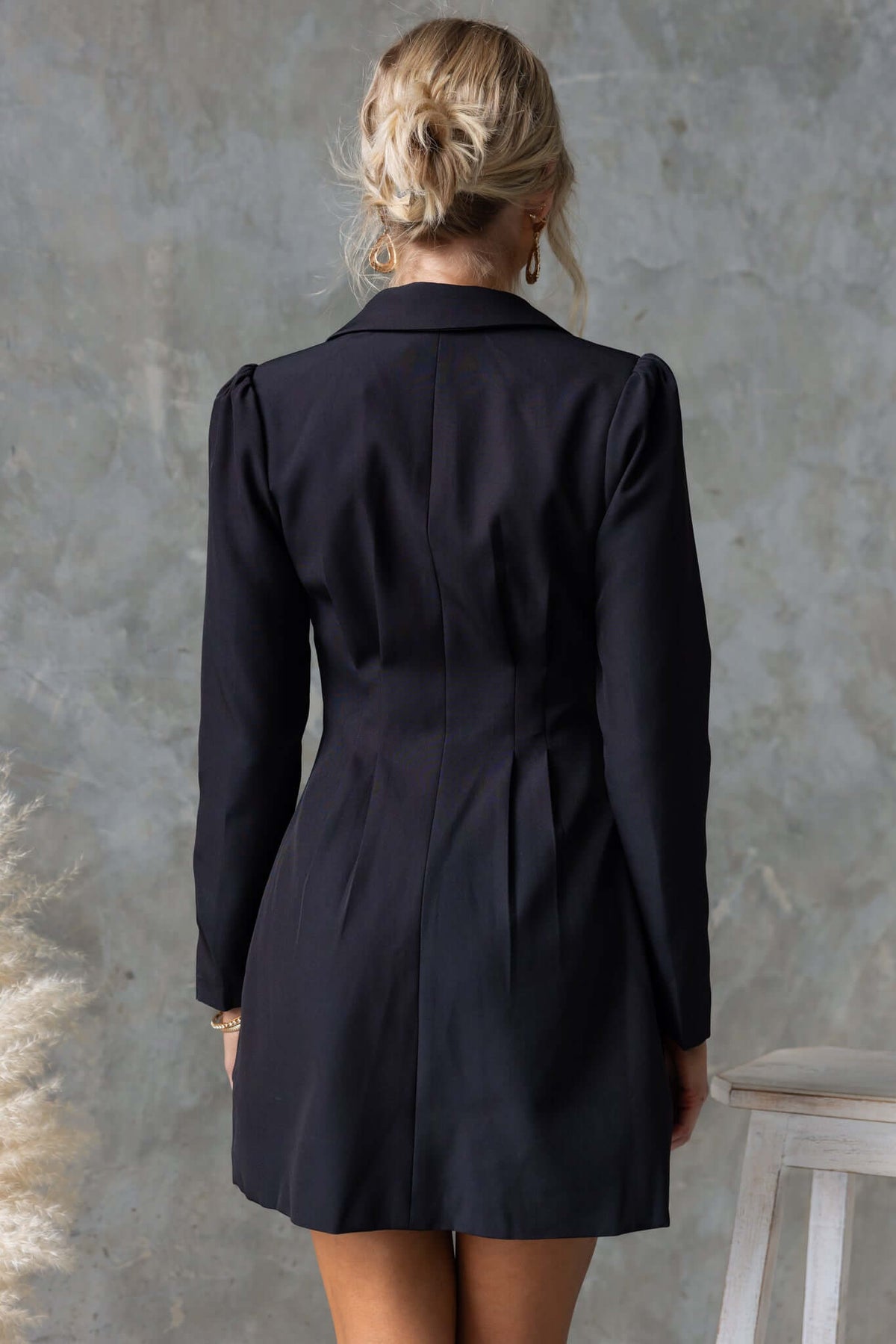 Brookings Dress with V-neckline and shoulder pads, shown from the back, elegant black polyester design.