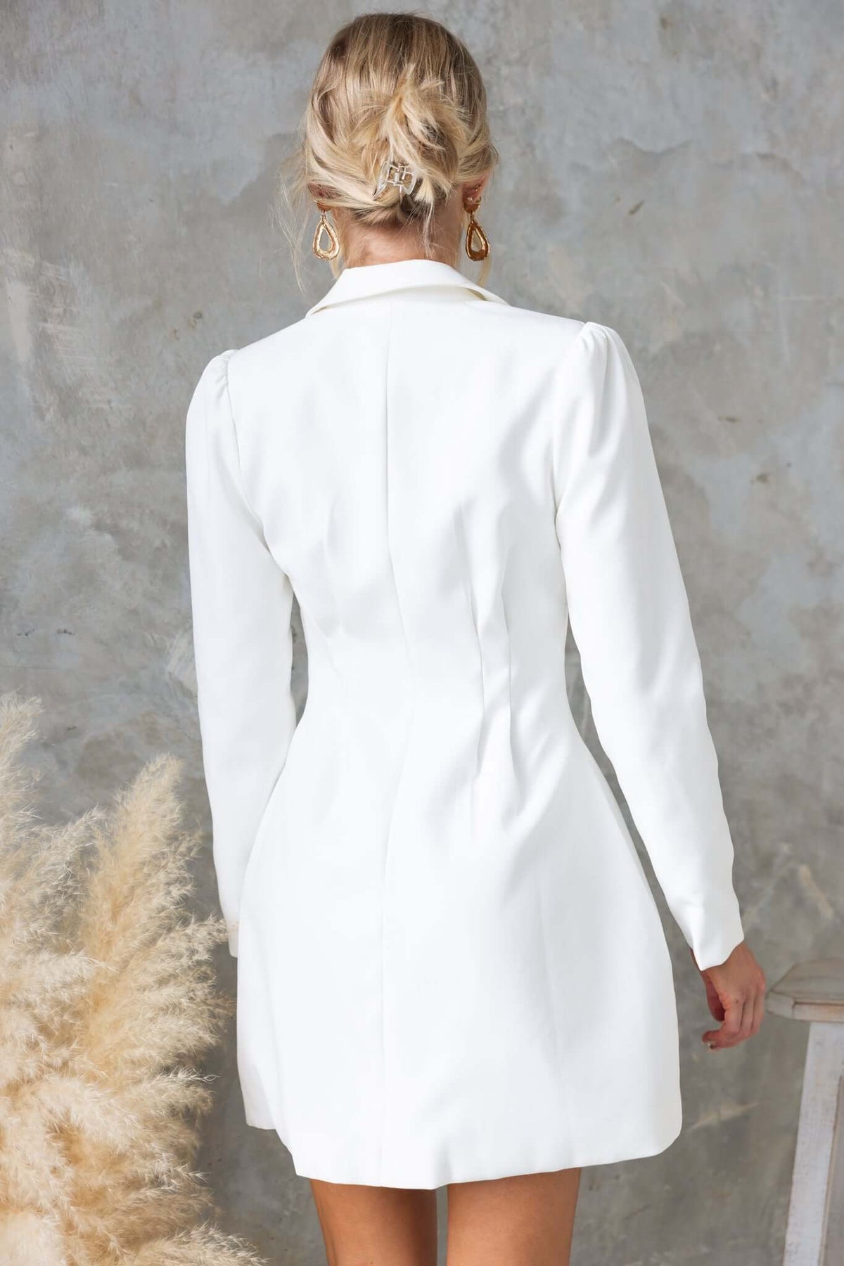 Back view of the Brookings Dress featuring a V-neckline and shoulder pads, perfect for stylish looks.