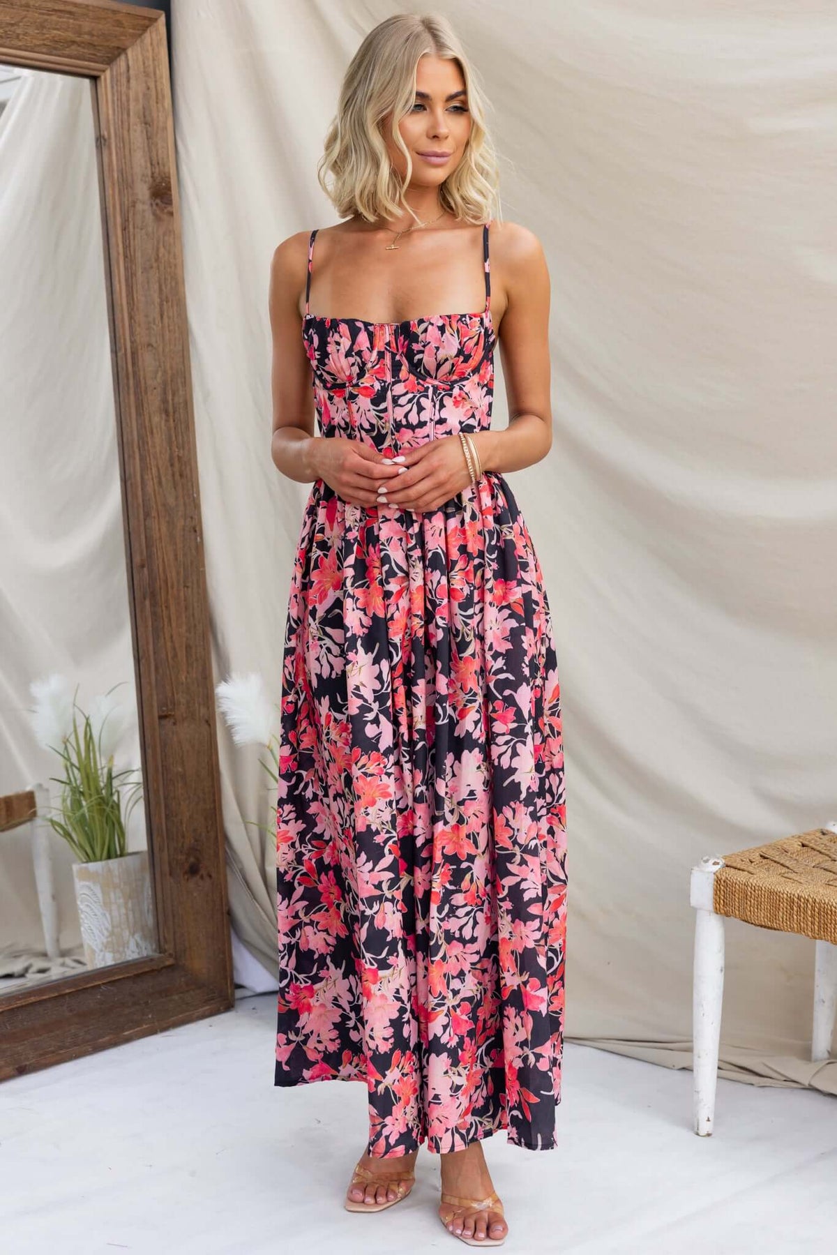 Elegant Burkes Midi Dress in floral print, featuring adjustable straps and a flattering fitted bodice.