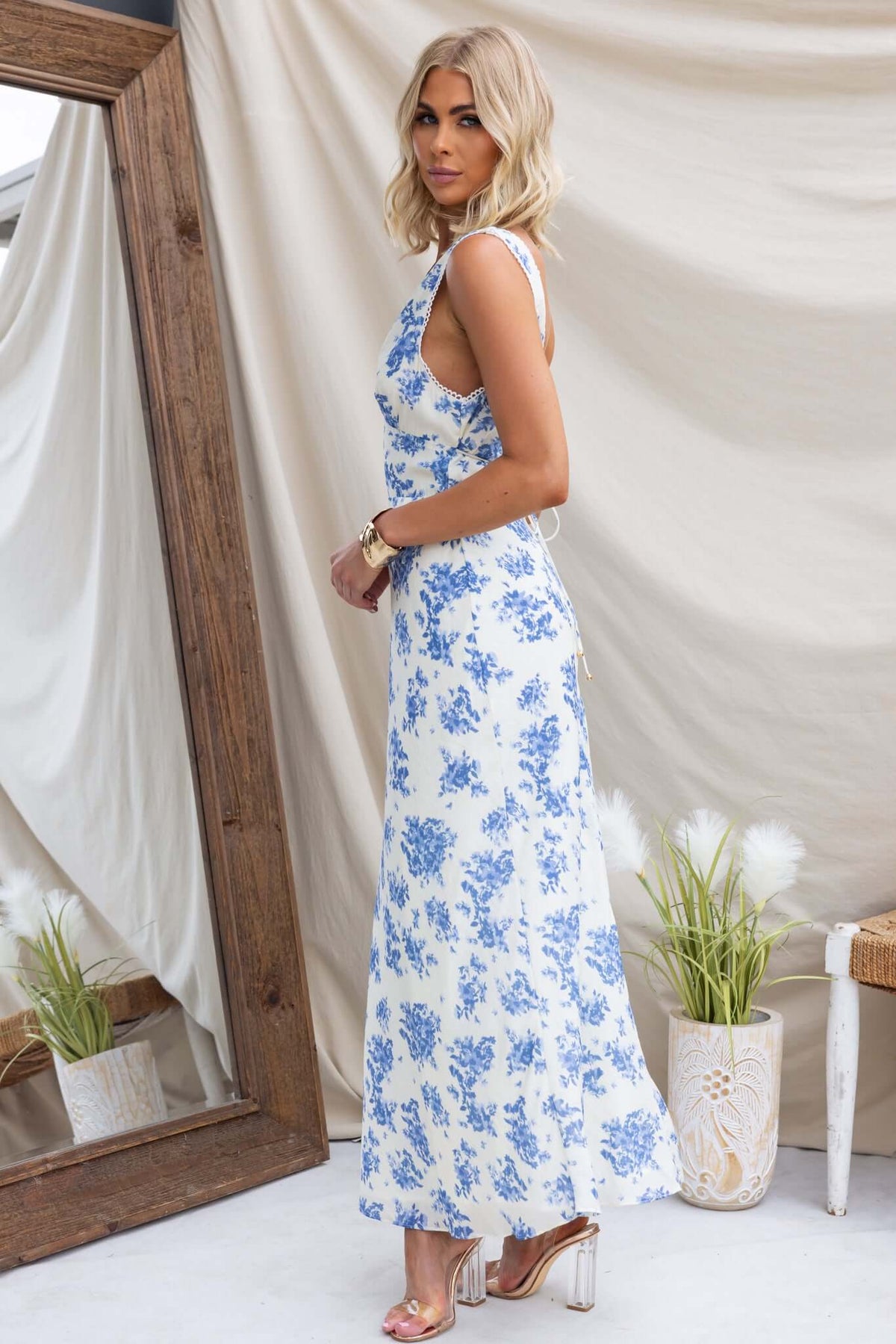 Cannon Maxi Dress featuring V-neckline, tie at waist, in a floral pattern.