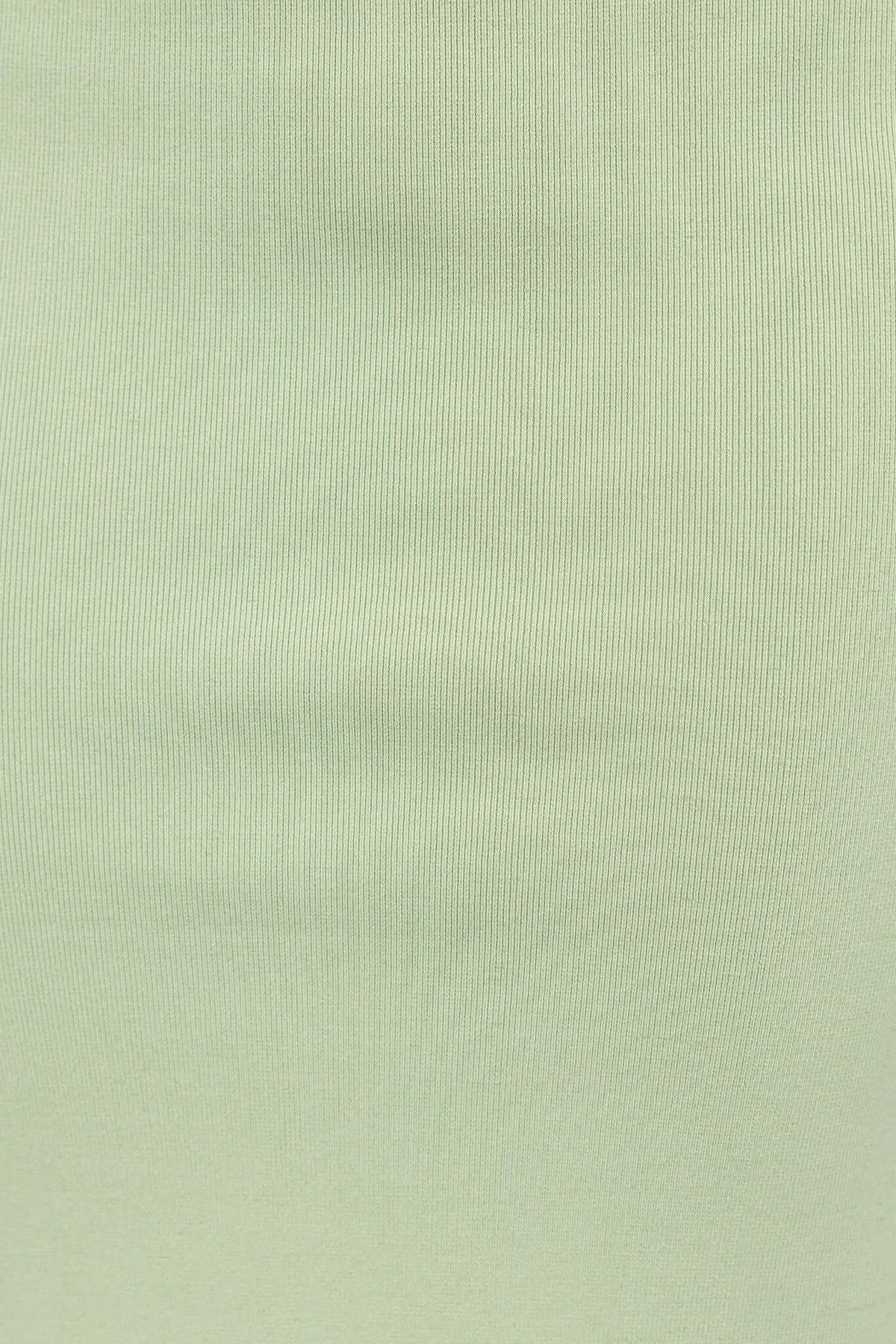 Close-up of Tammie Midi Skirt fabric in light green, showcasing soft knit texture and stretch.