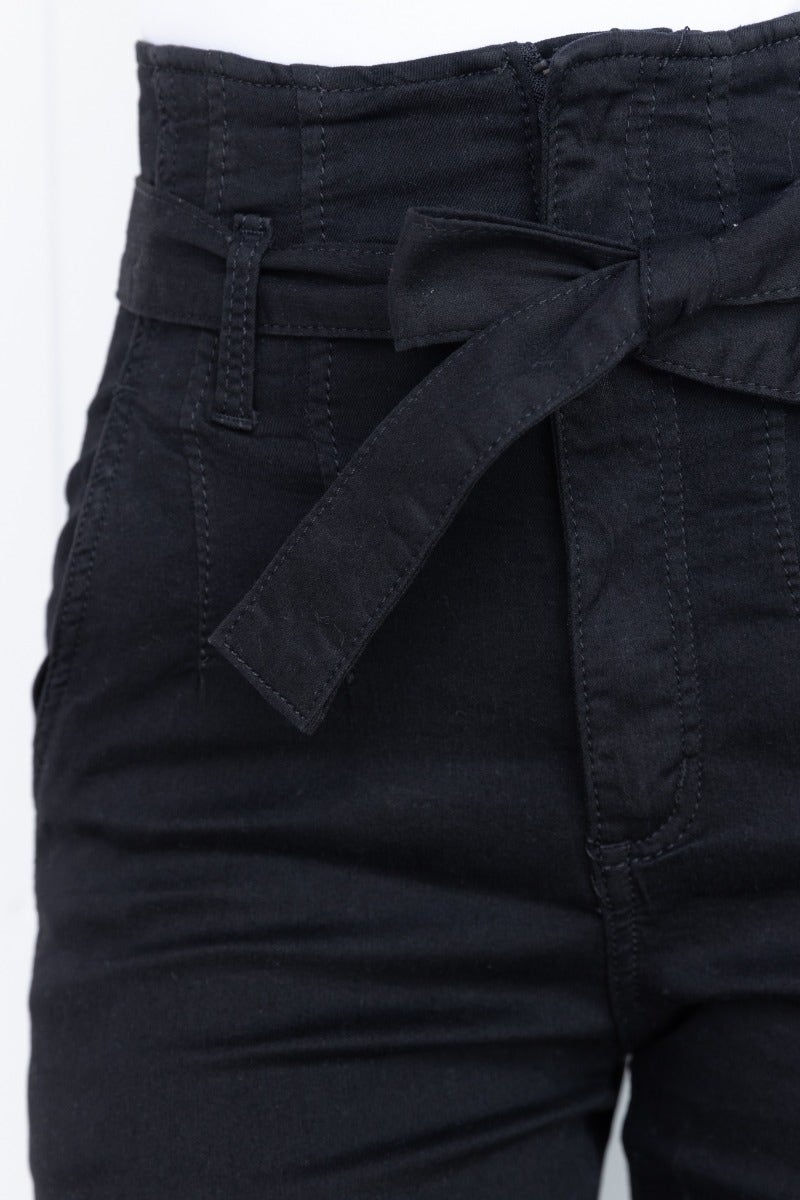 Close-up of New Hope Paper Bag Jeans showing black high waist, removable fabric belt, and detailed stitching.