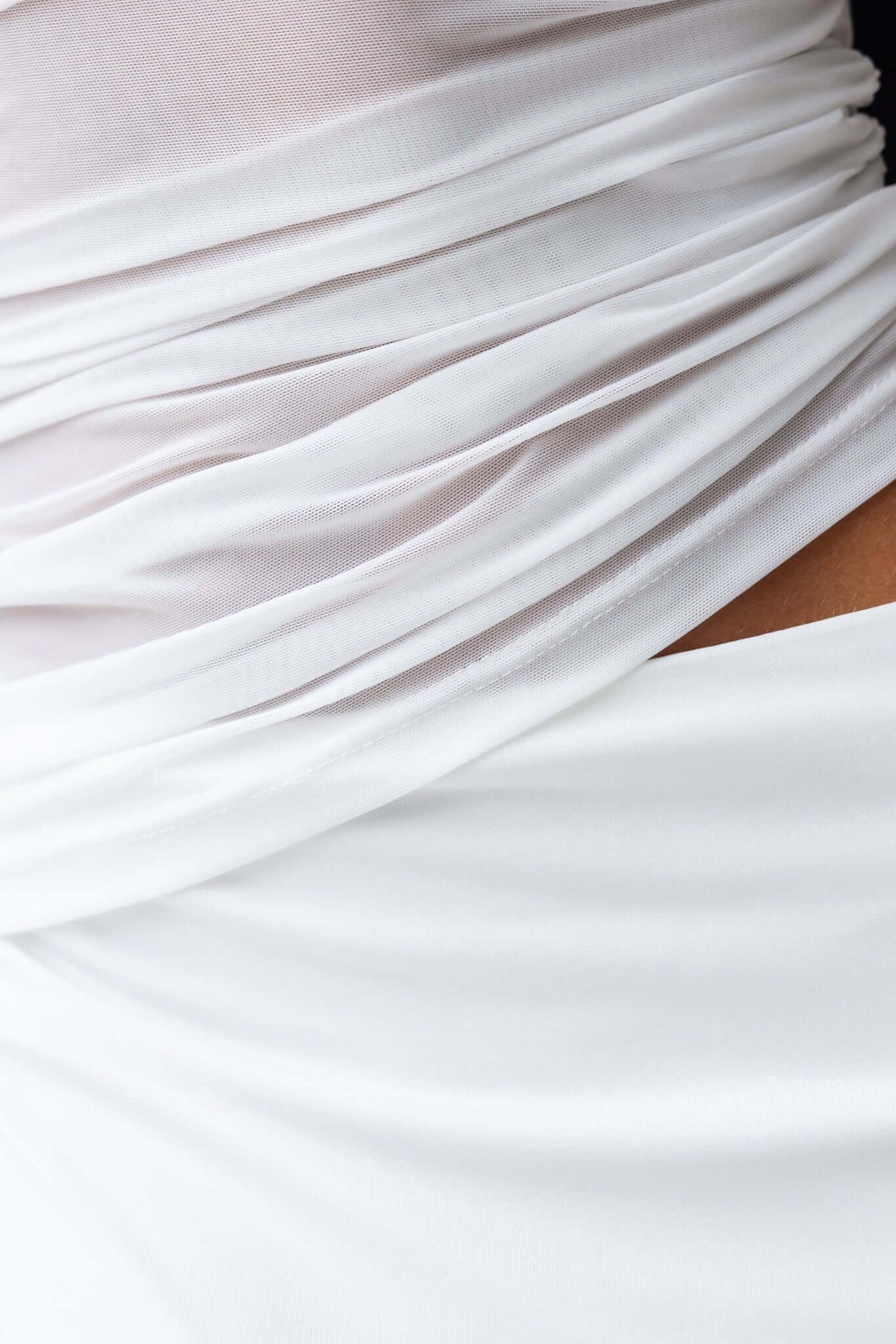 Close-up of the Denham Maxi Dress showing its elegant ruched design and soft, stretch fabric.
