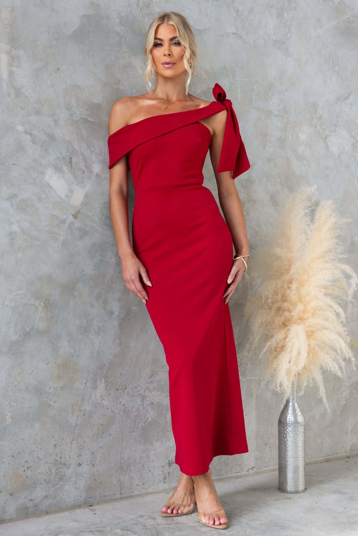 Red Devon Midi Dress featuring asymmetric neckline and tie detail, perfect for elegant occasions.