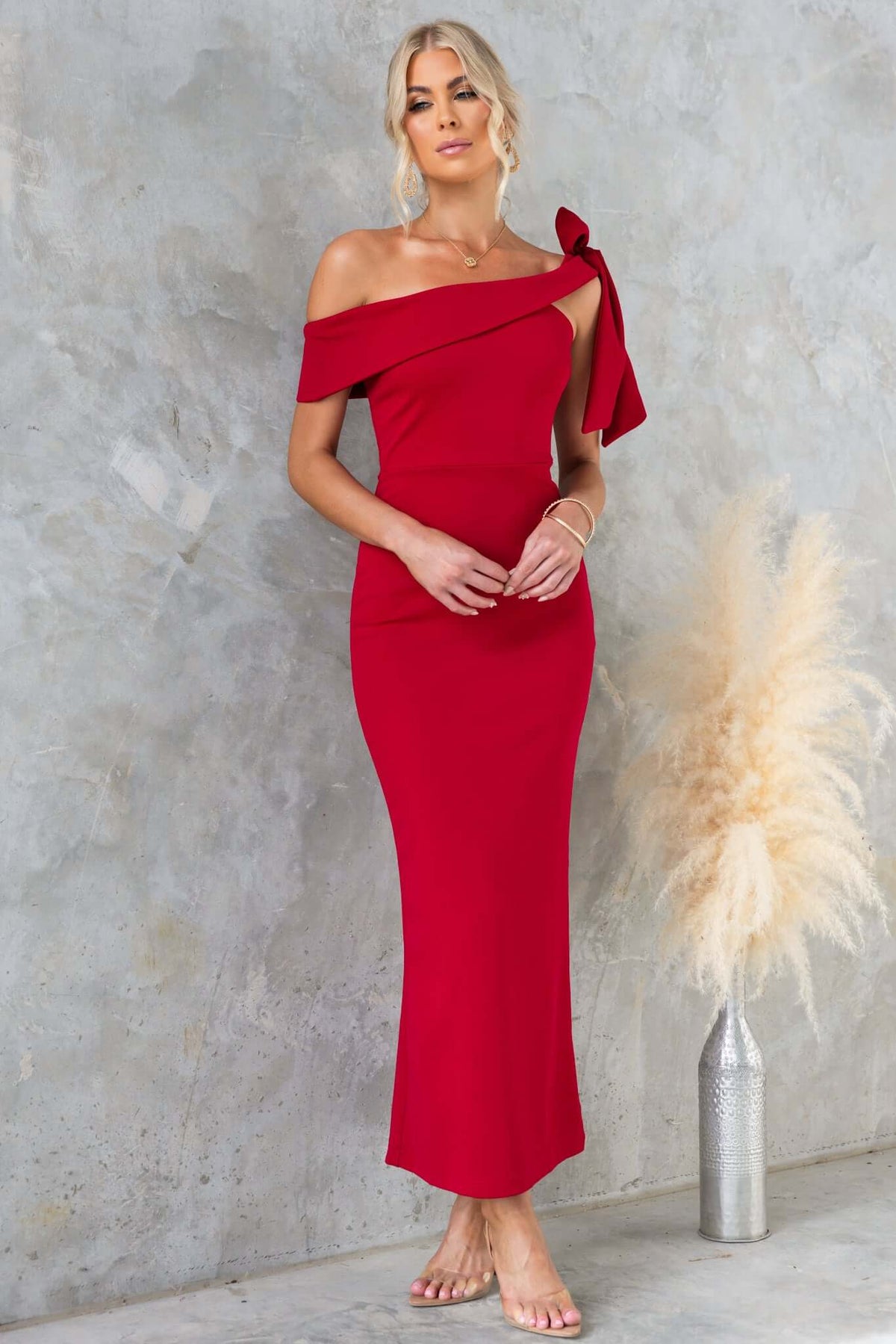 Devon Midi Dress features an asymmetric neckline with tie detail, perfect for an elegant evening look.