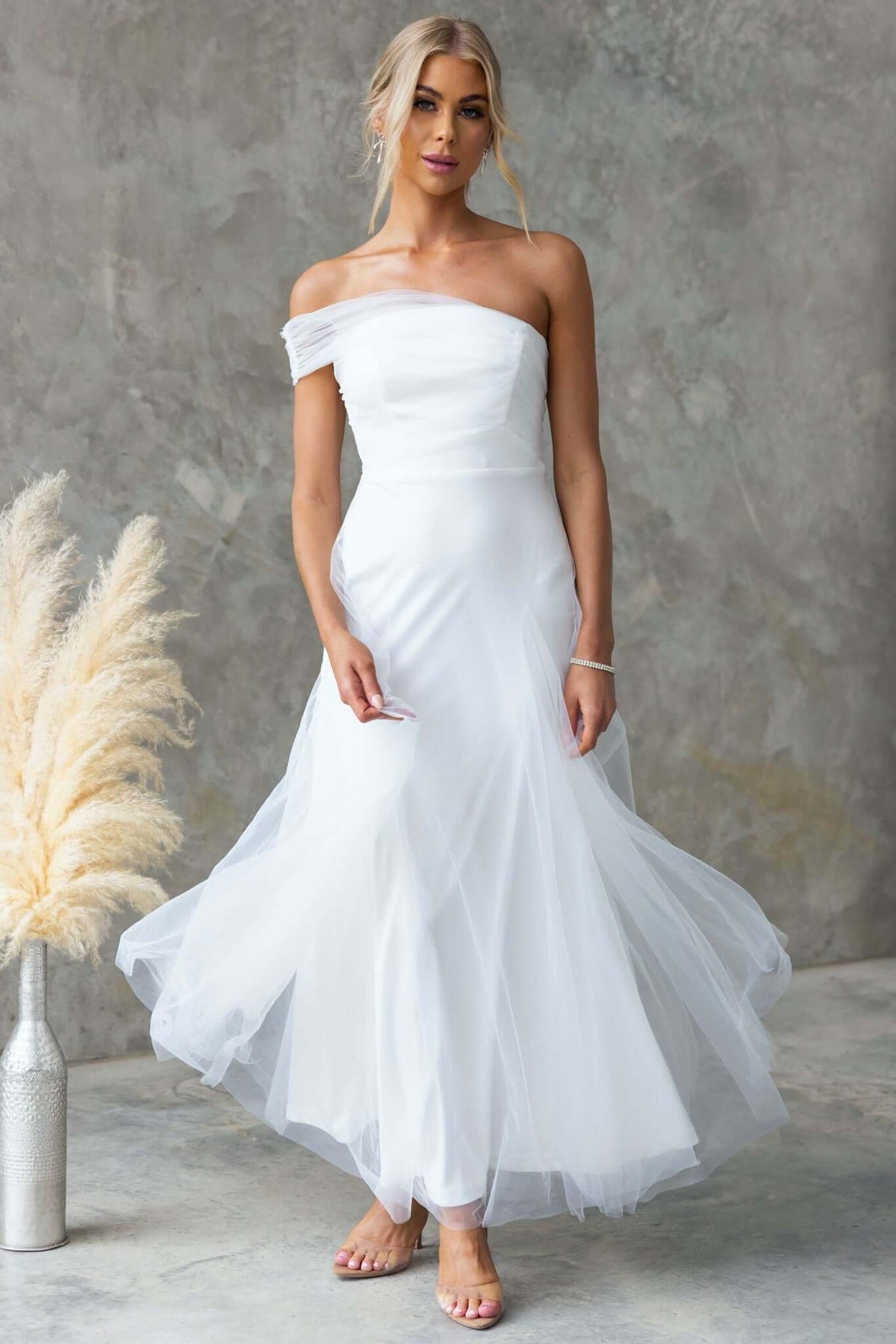 Eleah Maxi Dress featuring one-shoulder neckline, tulle material, and a flowing silhouette, ideal for bridal occasions.