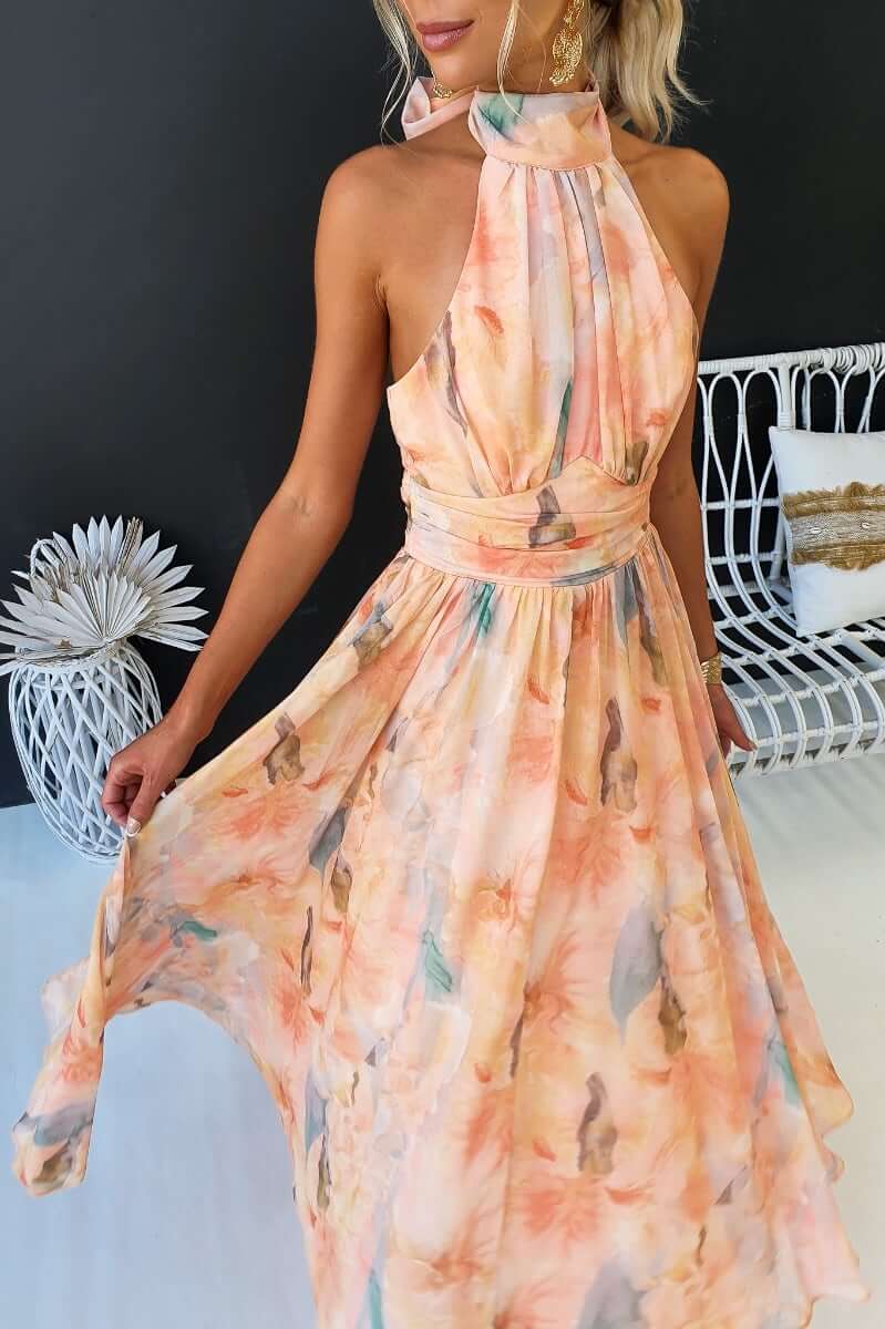 Little Things Maxi Dress featuring a floral print, high tie neckline, and flowing skirt, perfect for summer events.