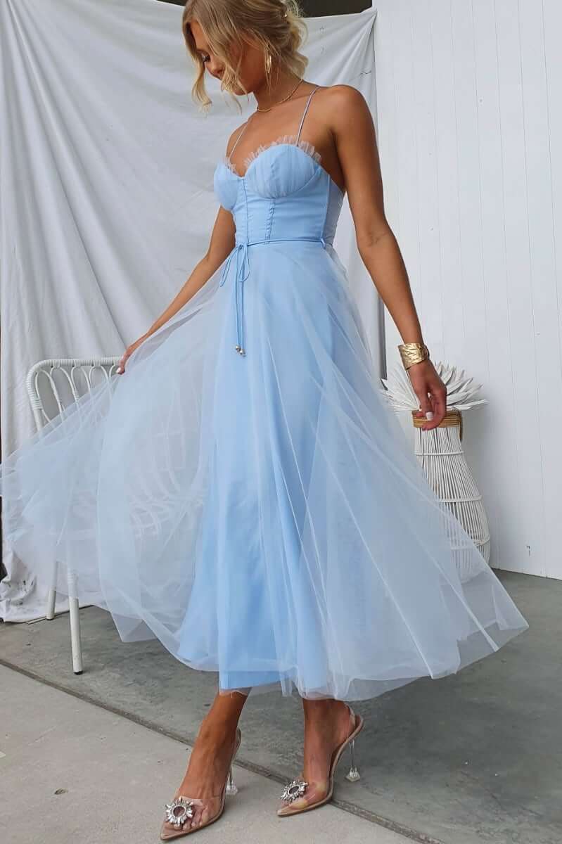 Elegant Florence Midi Dress in light blue with tulle overlay and adjustable straps, perfect for special occasions.