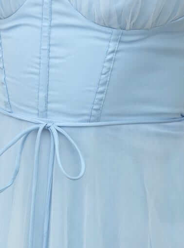 Detail of the Florence Midi Dress showing adjustable tie, padded bust, and soft tulle material in light blue.